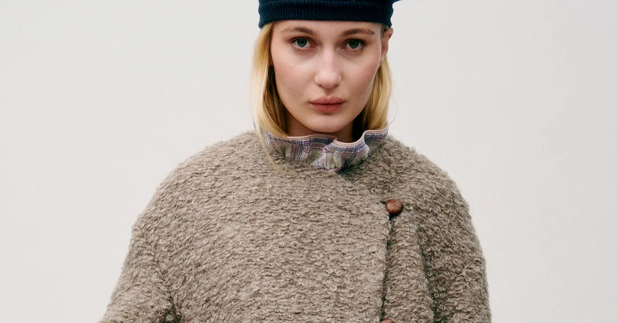 Woman in grey wool jacket with buttons