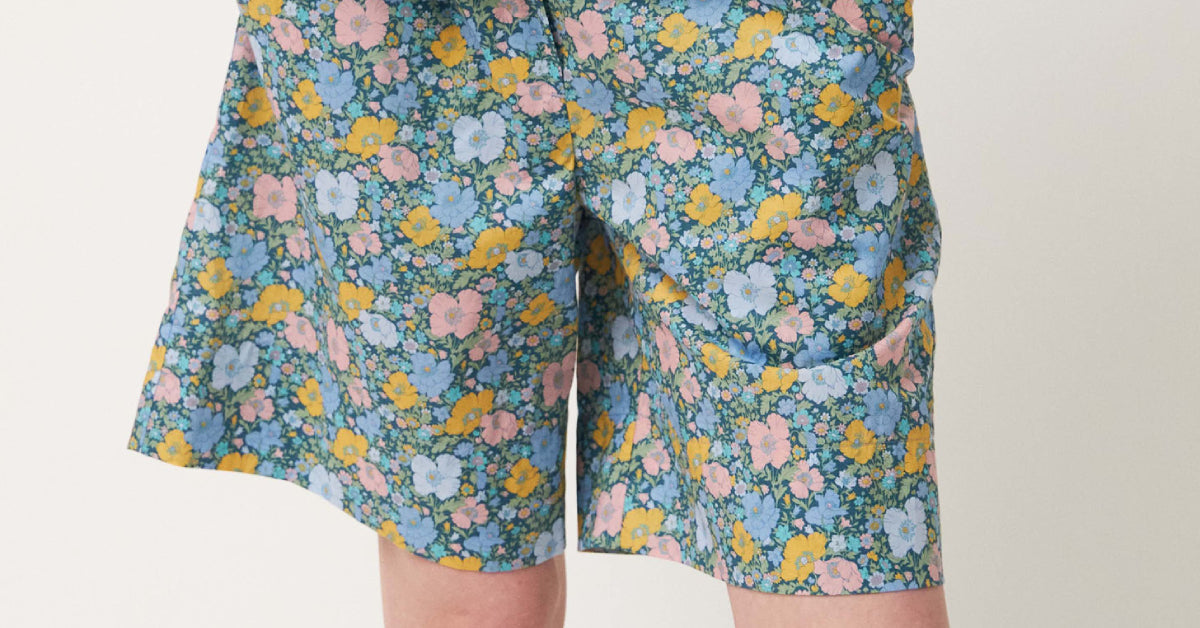 Women in Liberty cotton shorts with multi-colored floral pattern