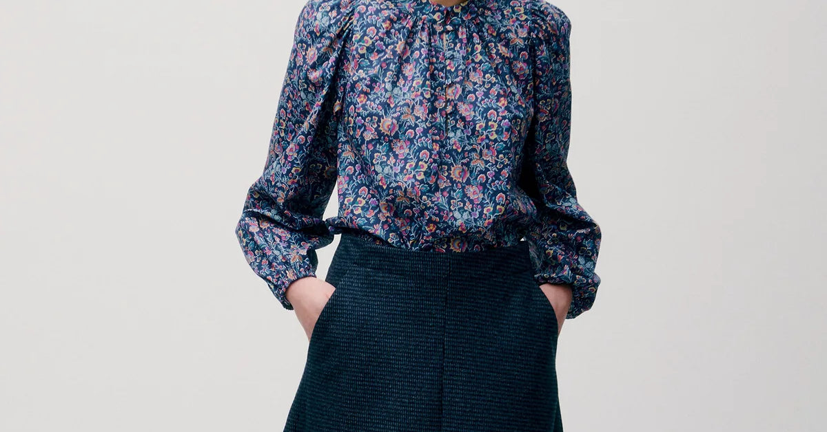 Woman in dark blue a-line tweed skirt