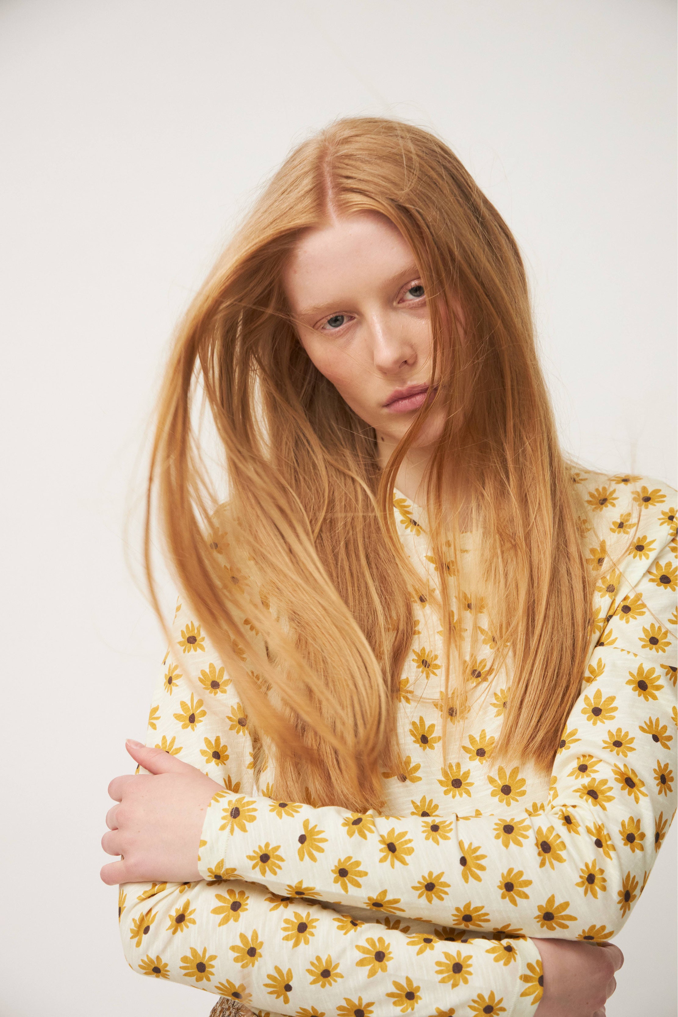Woman in long sleeve t-shirt with sunflower pattern