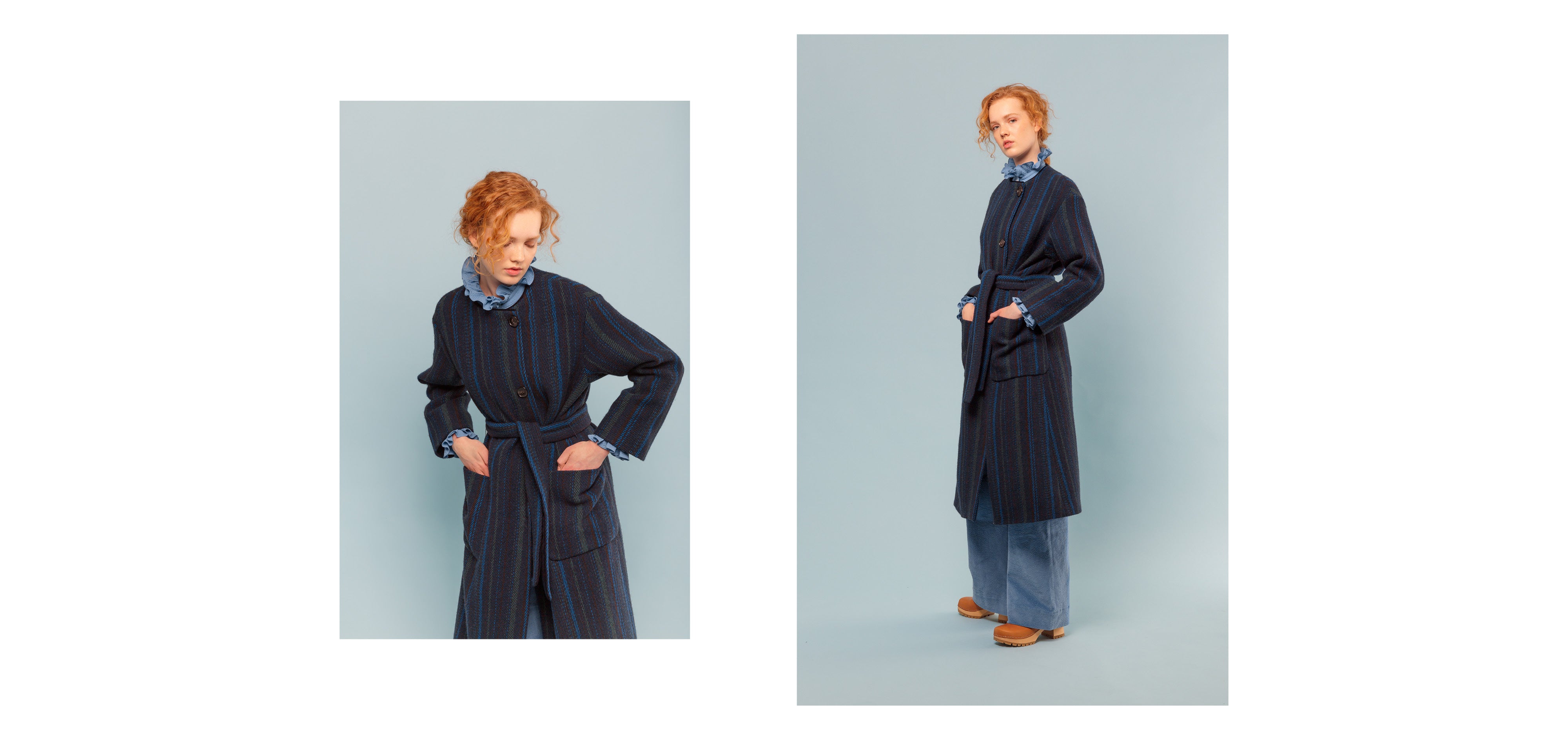 Woman in blue corduroy pants, blue shirt with frilled collar and cuffs and striped coat with pockets and belt