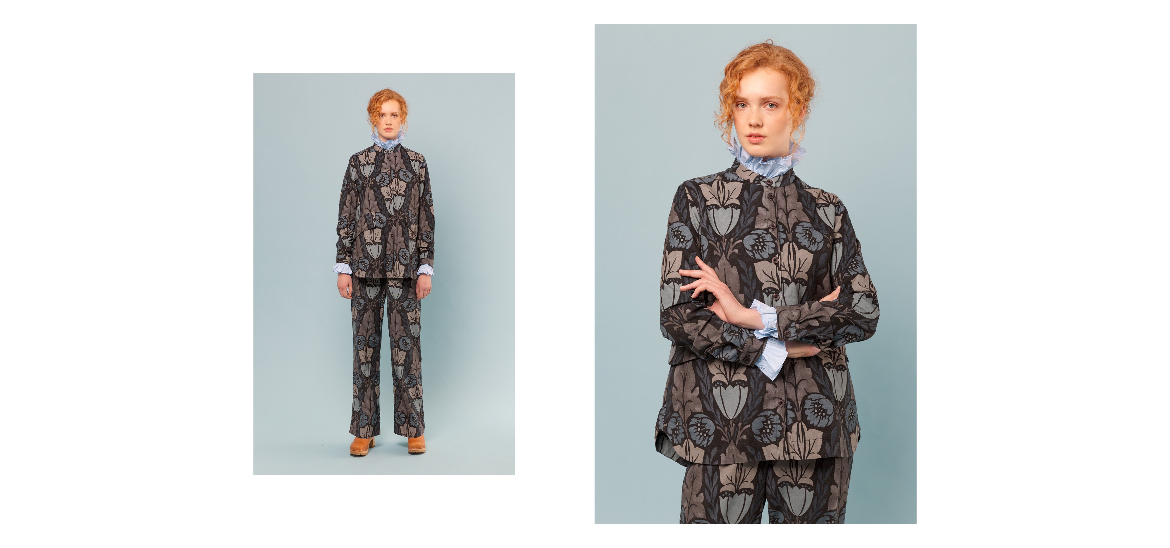 Woman in Liberty print cotton pants and jacket with large flower print and blue shirt with frilled collar