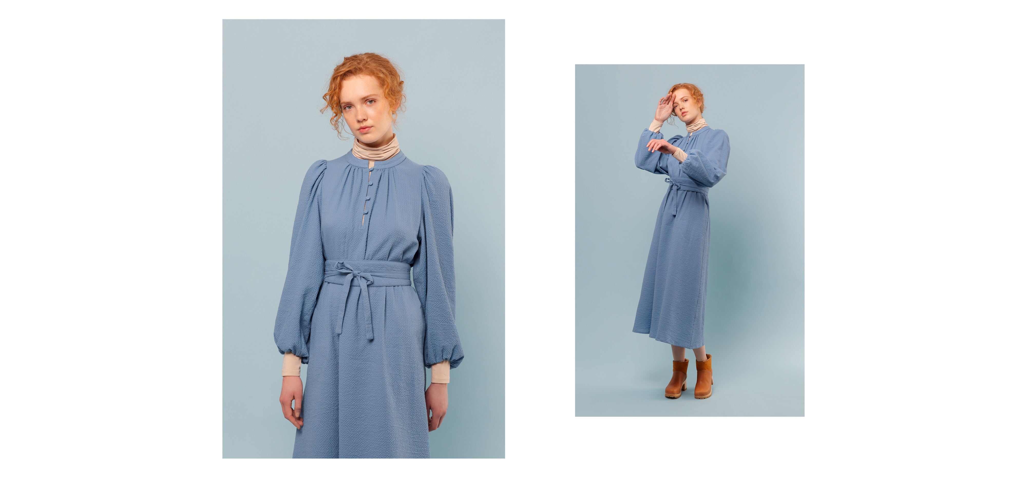Woman in blue midi dress with long cuffed sleeves, buttons and belt and beige roll neck