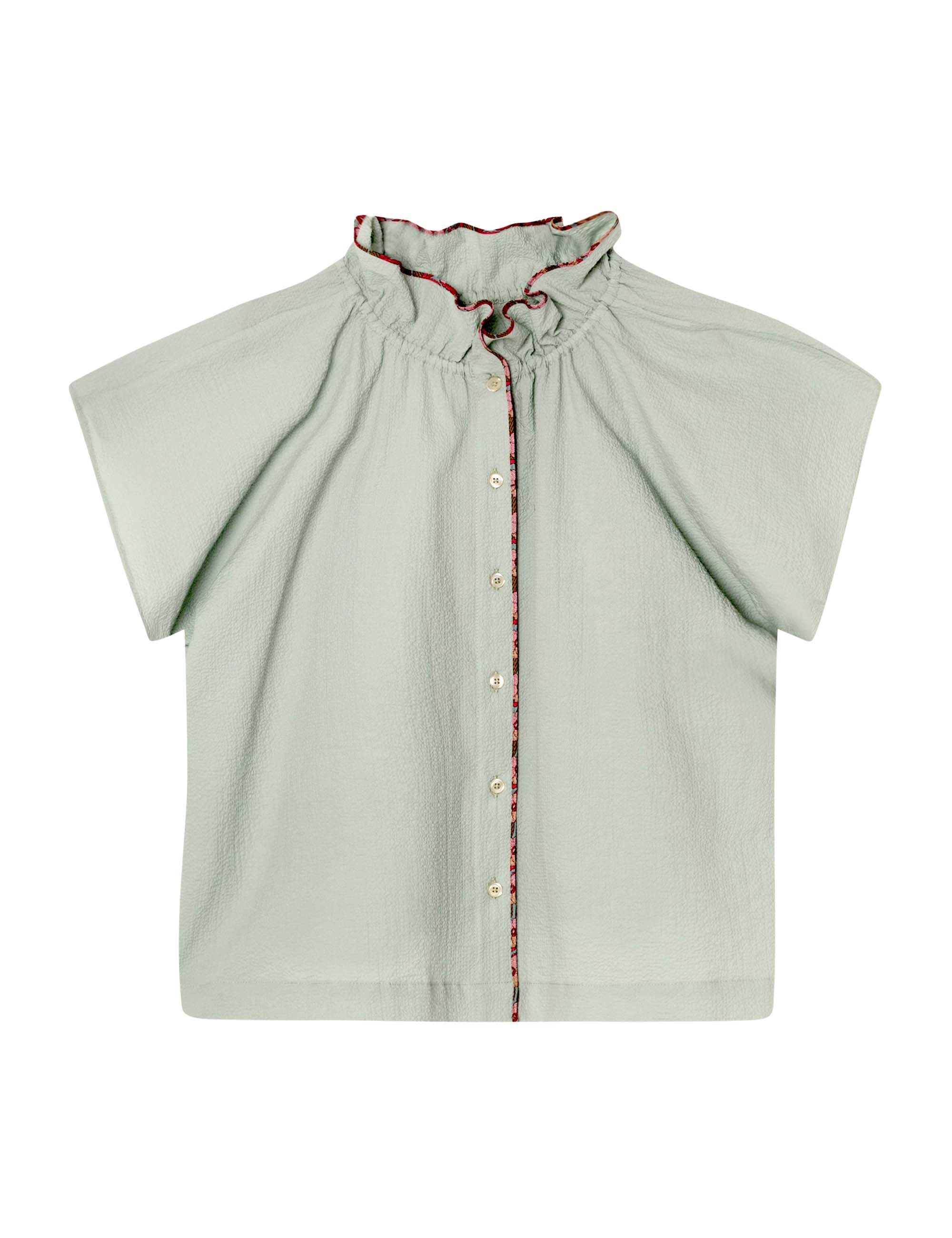 Blue-green sleeveless top with frilled stand collar contrasting frilled collar and buttons