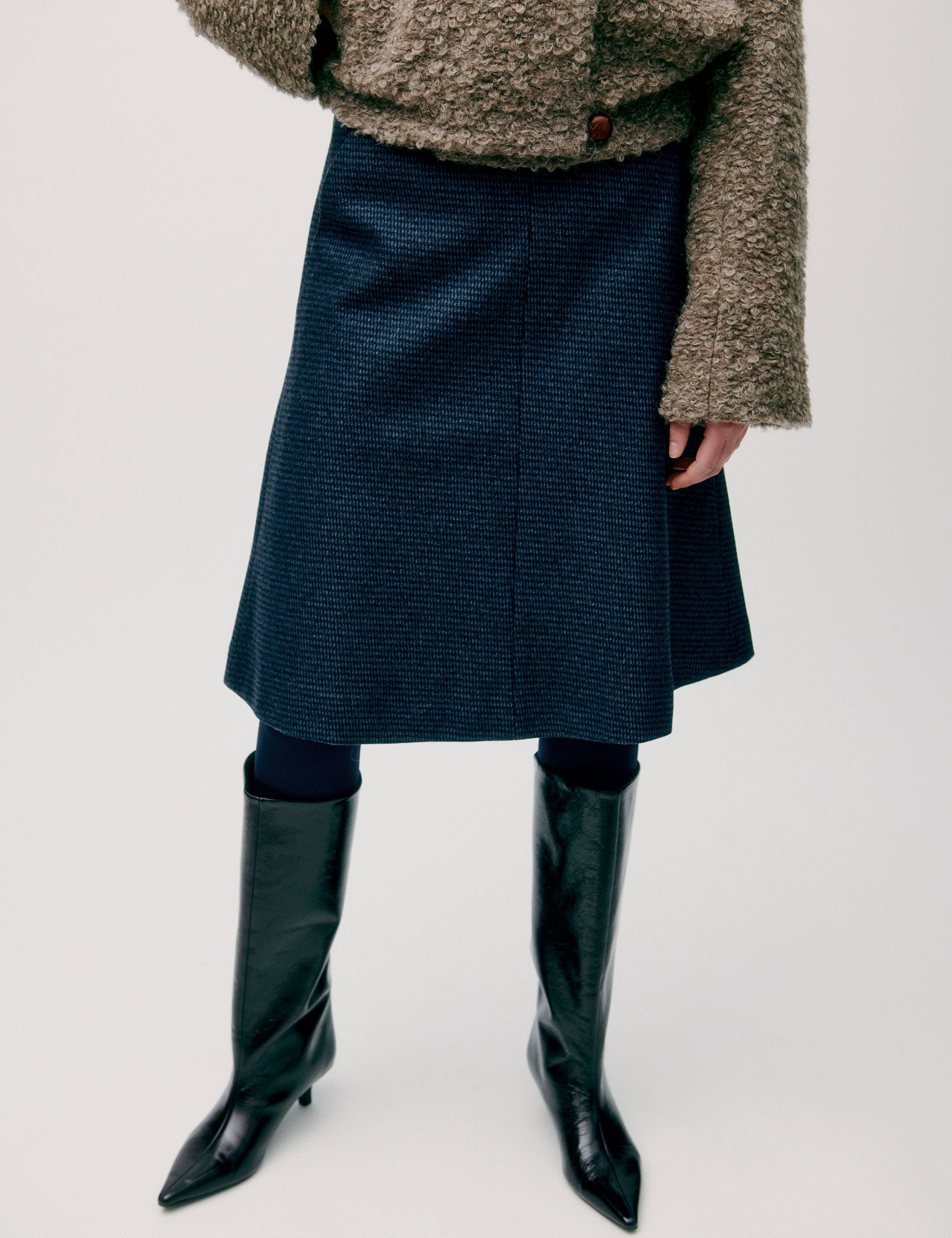 Dark blue tweed skirt with structured A-line silhouette