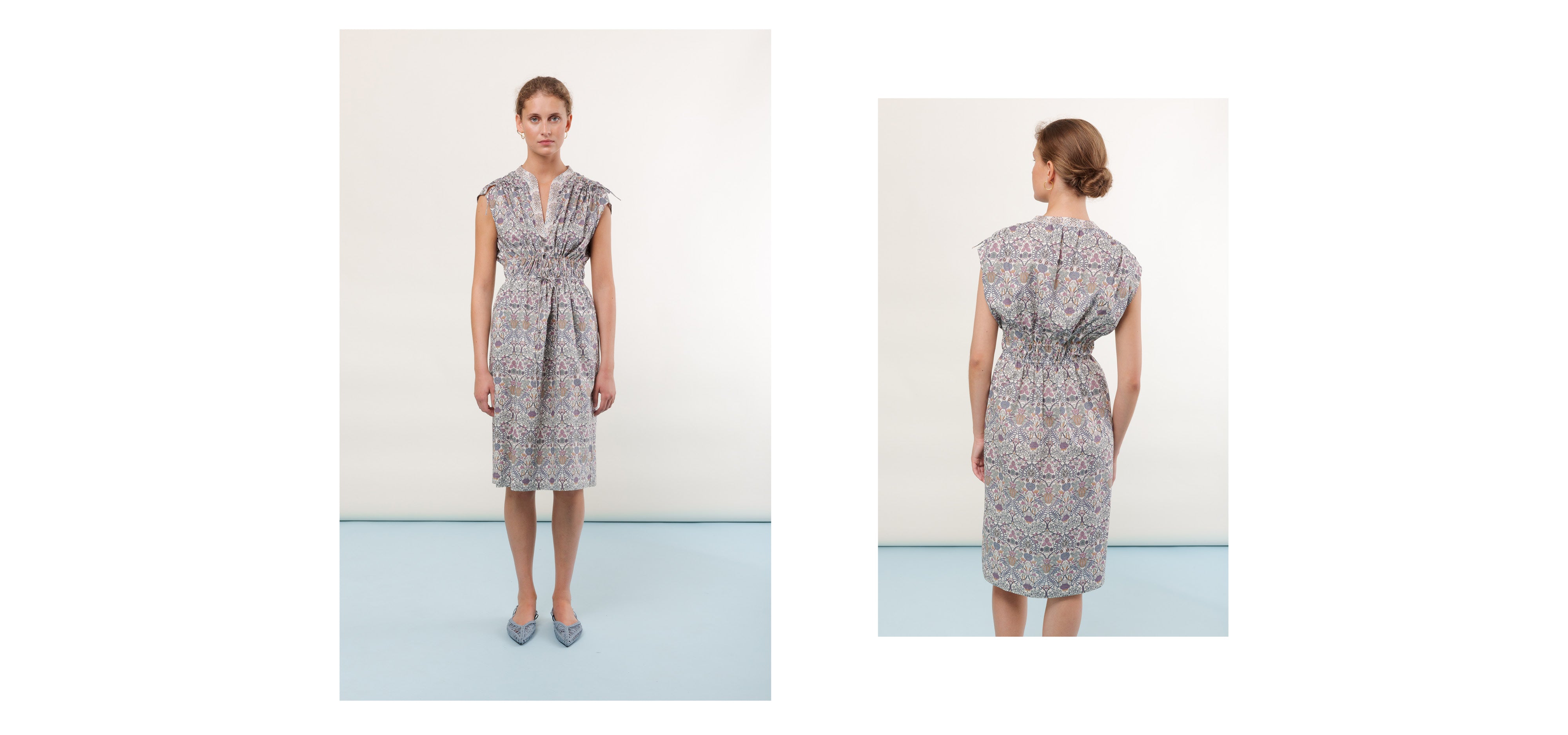 Woman in sleeveless midi Liberty cotton dress with multi-colored floral pattern