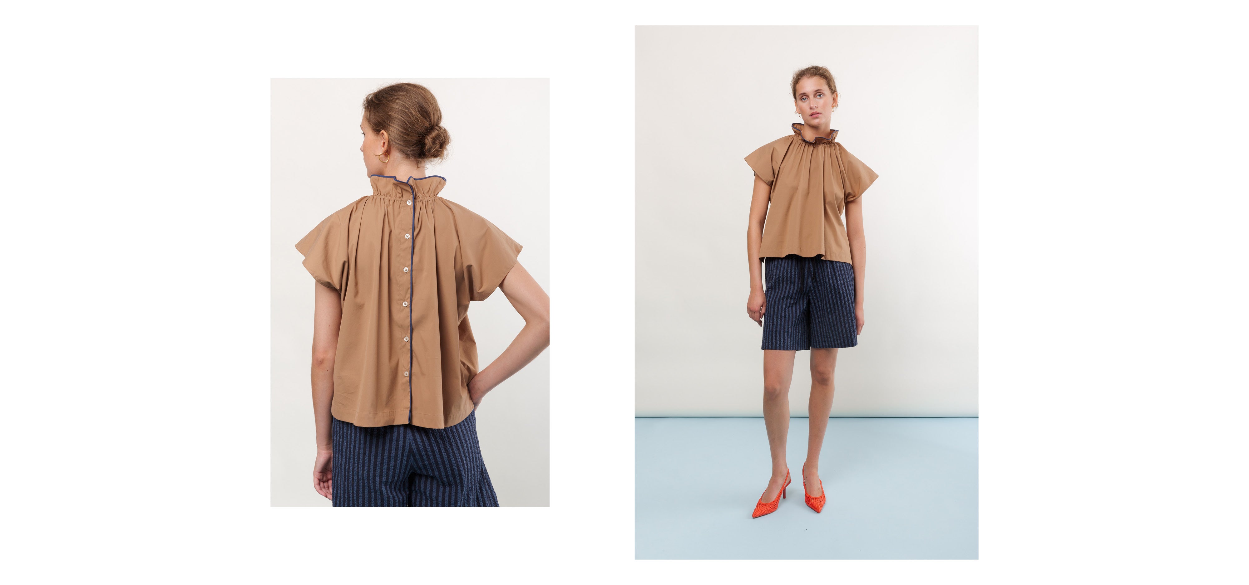 Woman in dark striped cotton shorts and brown short sleeved blouse with frilled collar and buttons on the back