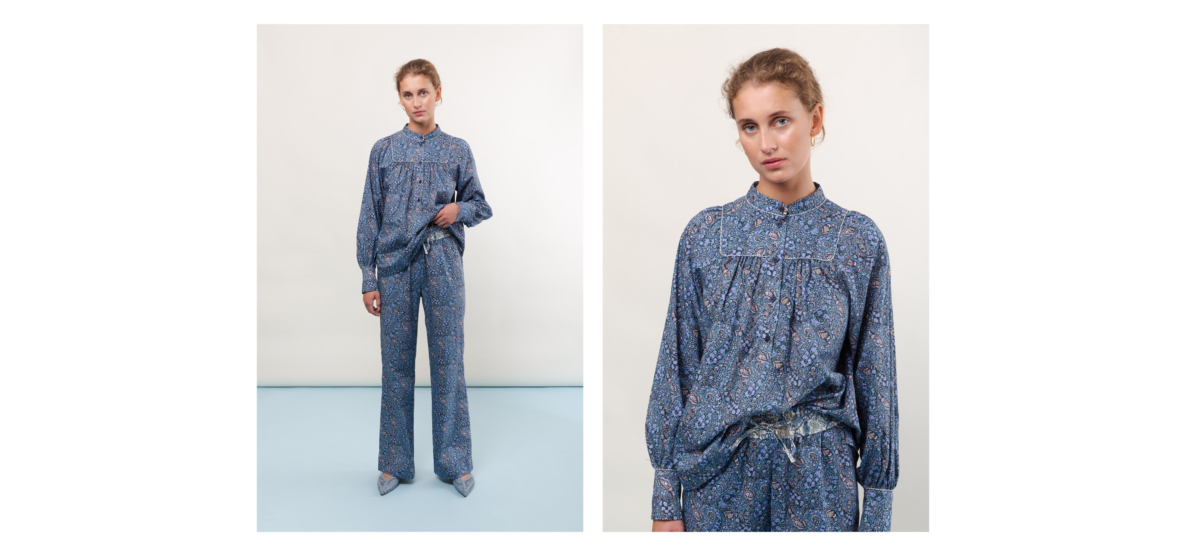 Woman in pants and long sleeved shirt in blue floral print Liberty cotton