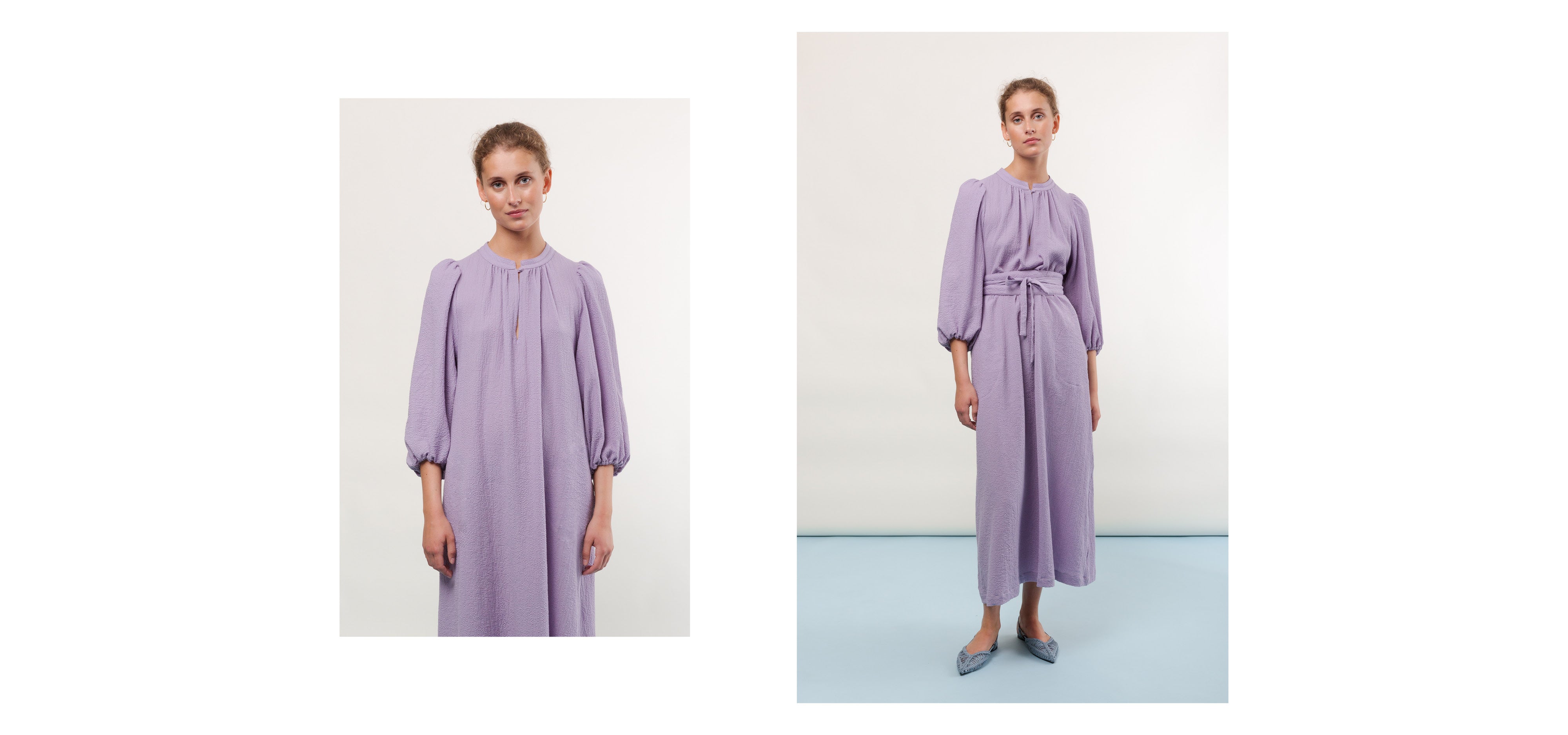 Woman in purple midi dress with puffed long sleeves and belt
