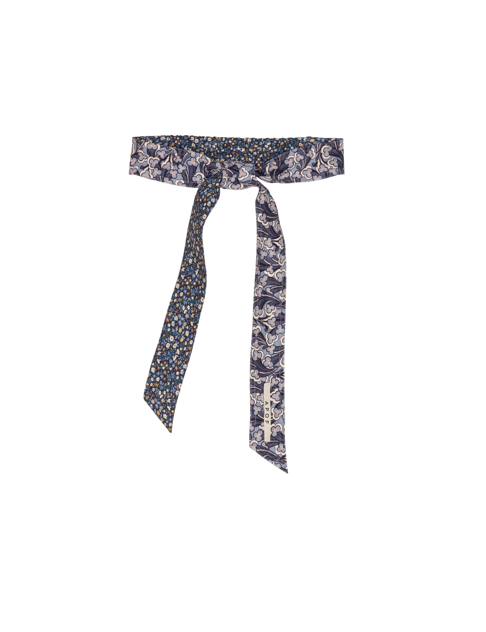 Floral patterned belt with a tie on a white background