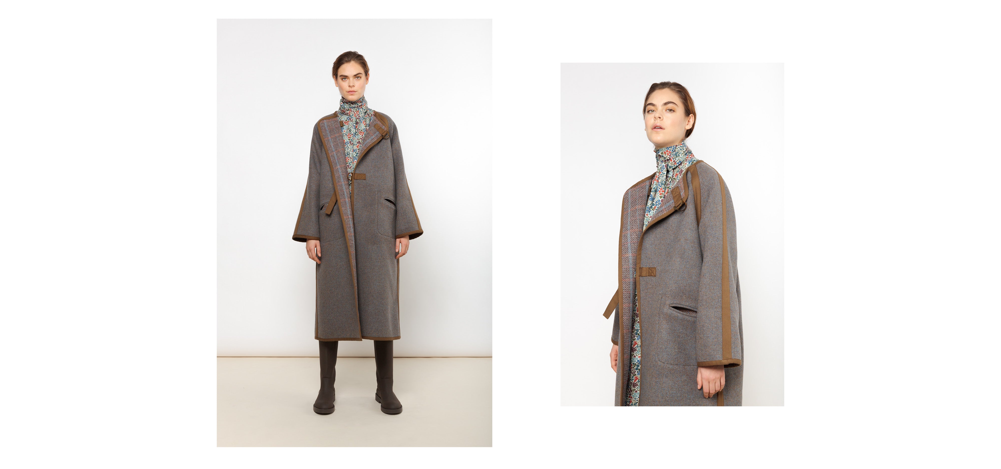 Woman in flower print shirt with frilled collar and long grey and brown wool coat
