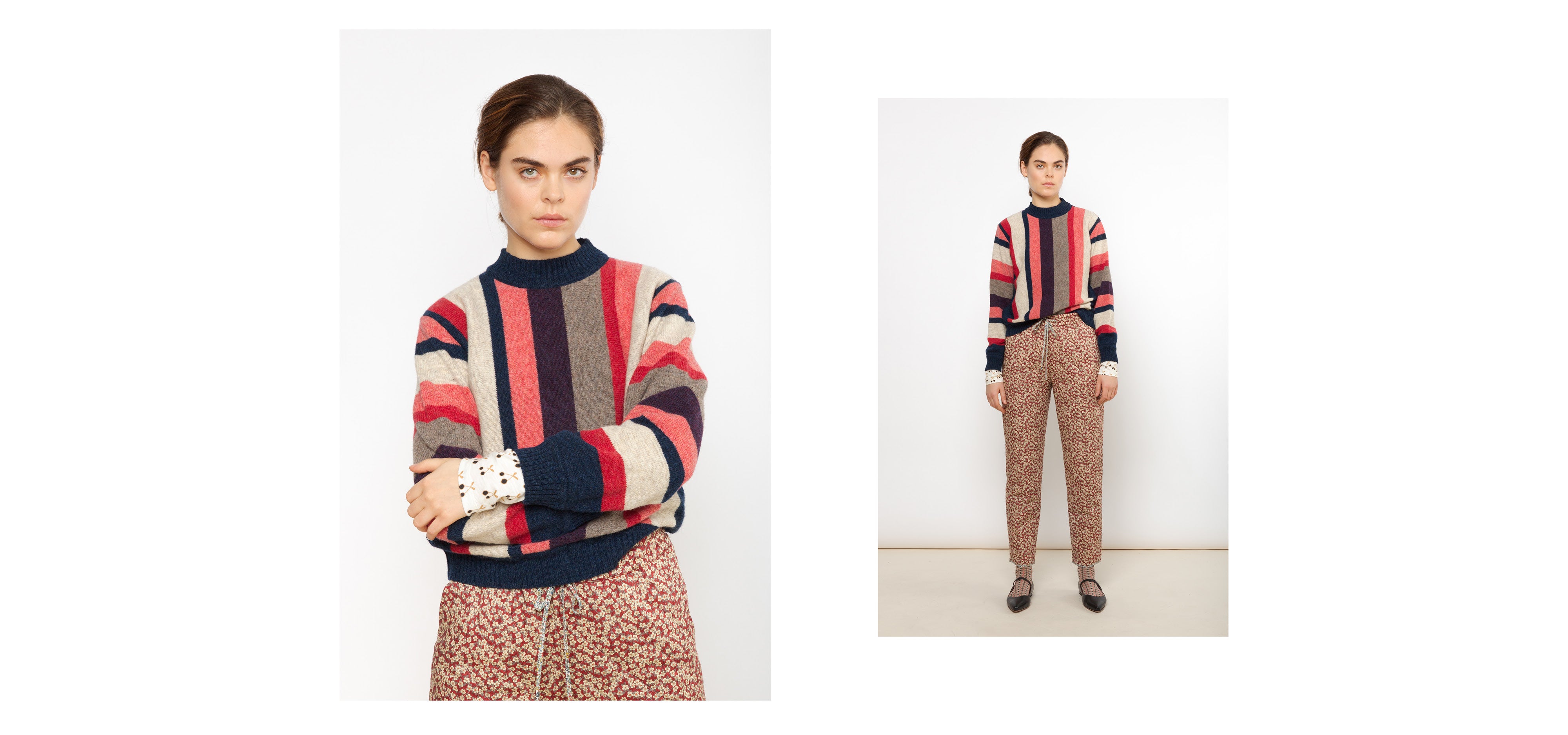 Woman in Liberty cotton pants with red and white floral print and striped multi-colored wool pullover