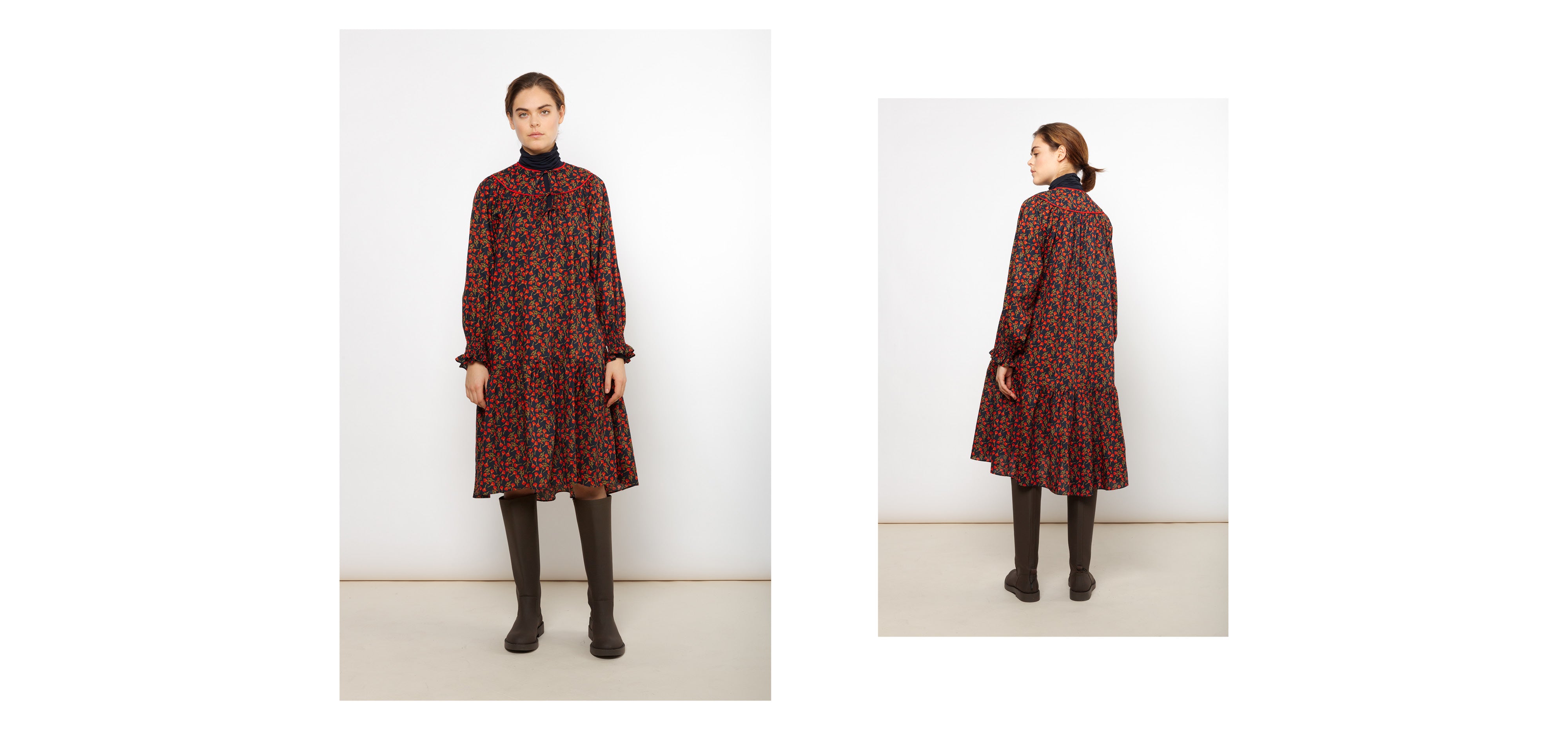 Woman in red and black midi dress with long sleeves, frilled cuffs and floral print