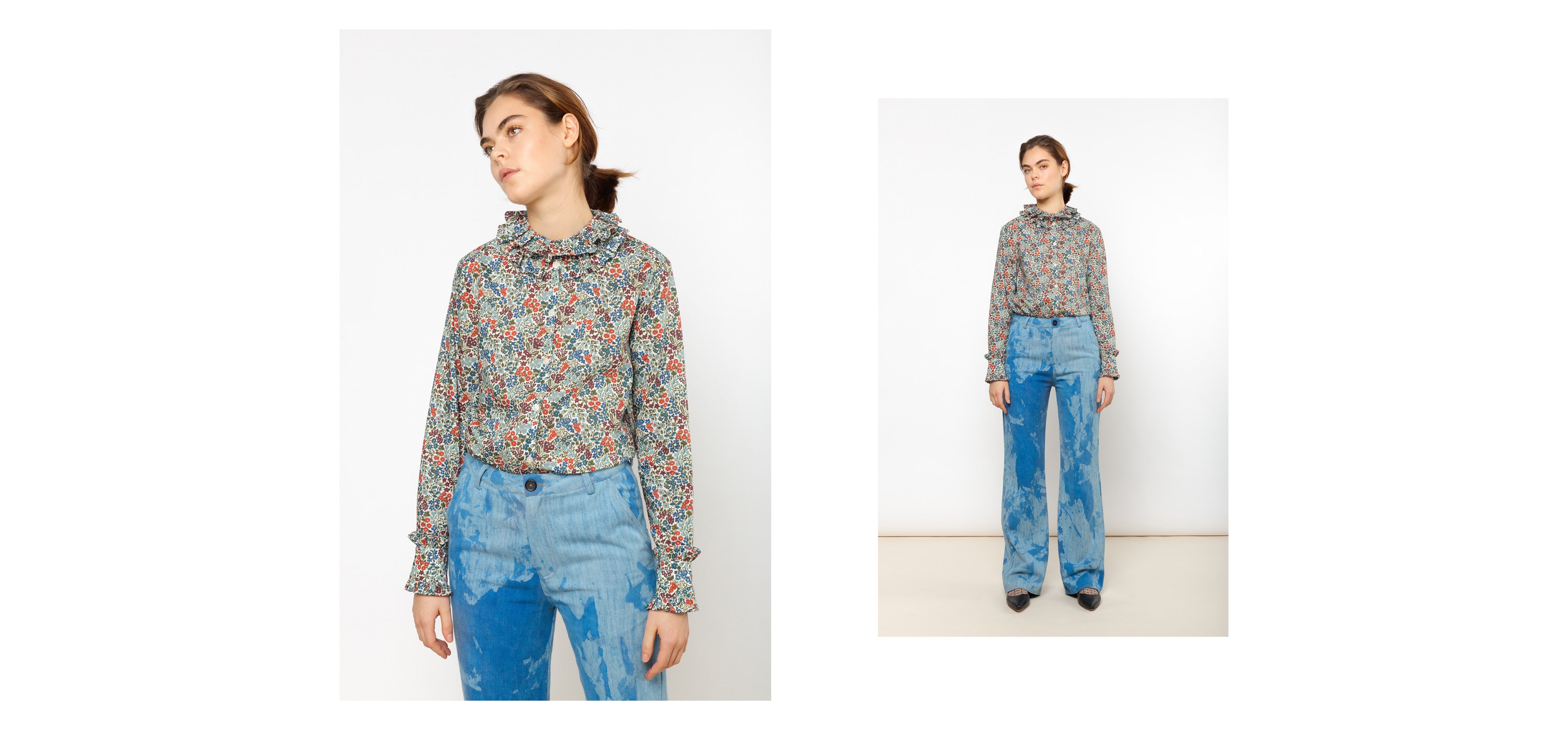 Woman in blue pants and multi-colored liberty cotton floral print shirt with frilled collar and cuffs