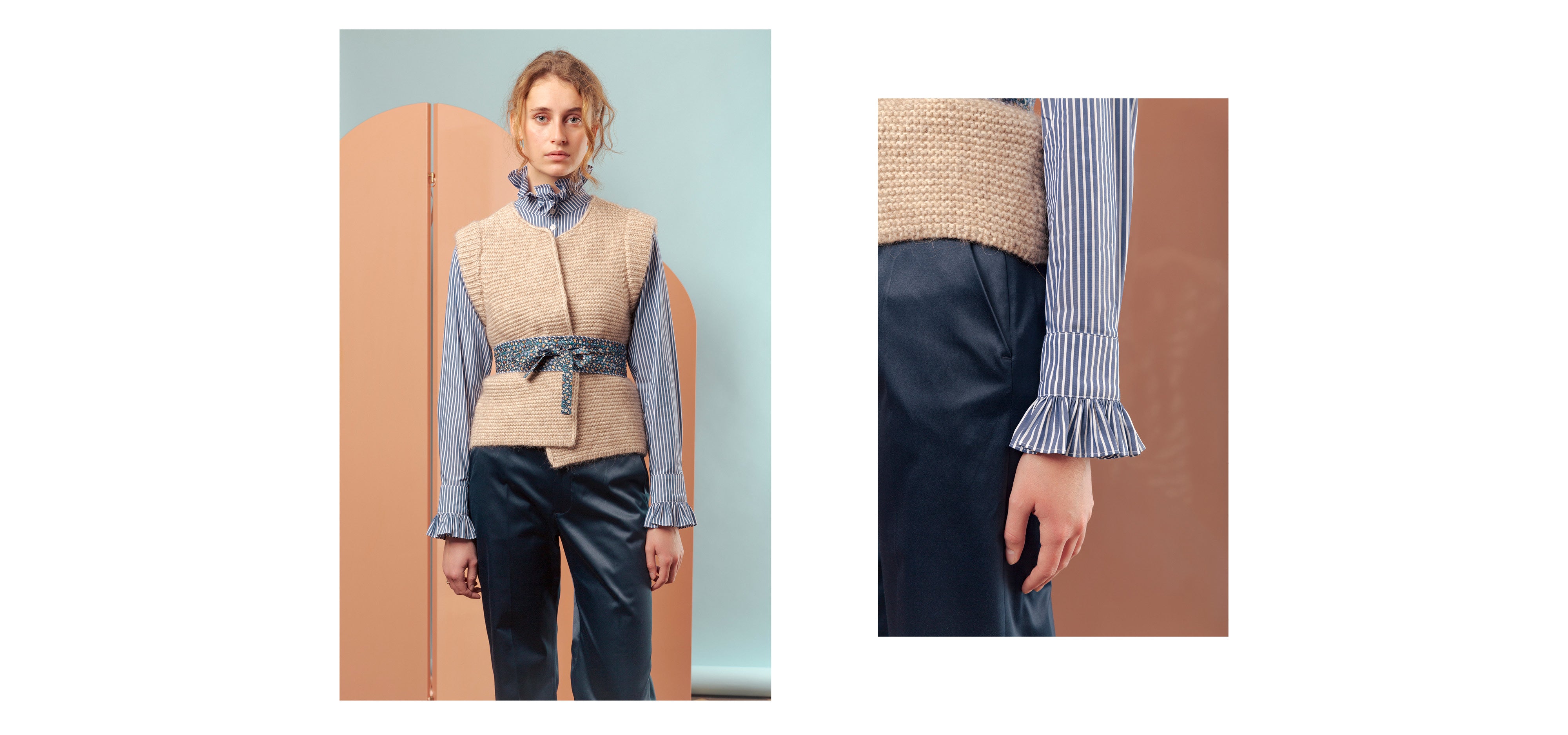 Woman in blue pants, blue and white striped long sleeved shirt with frilled cuffs and collar and beige knitted vest