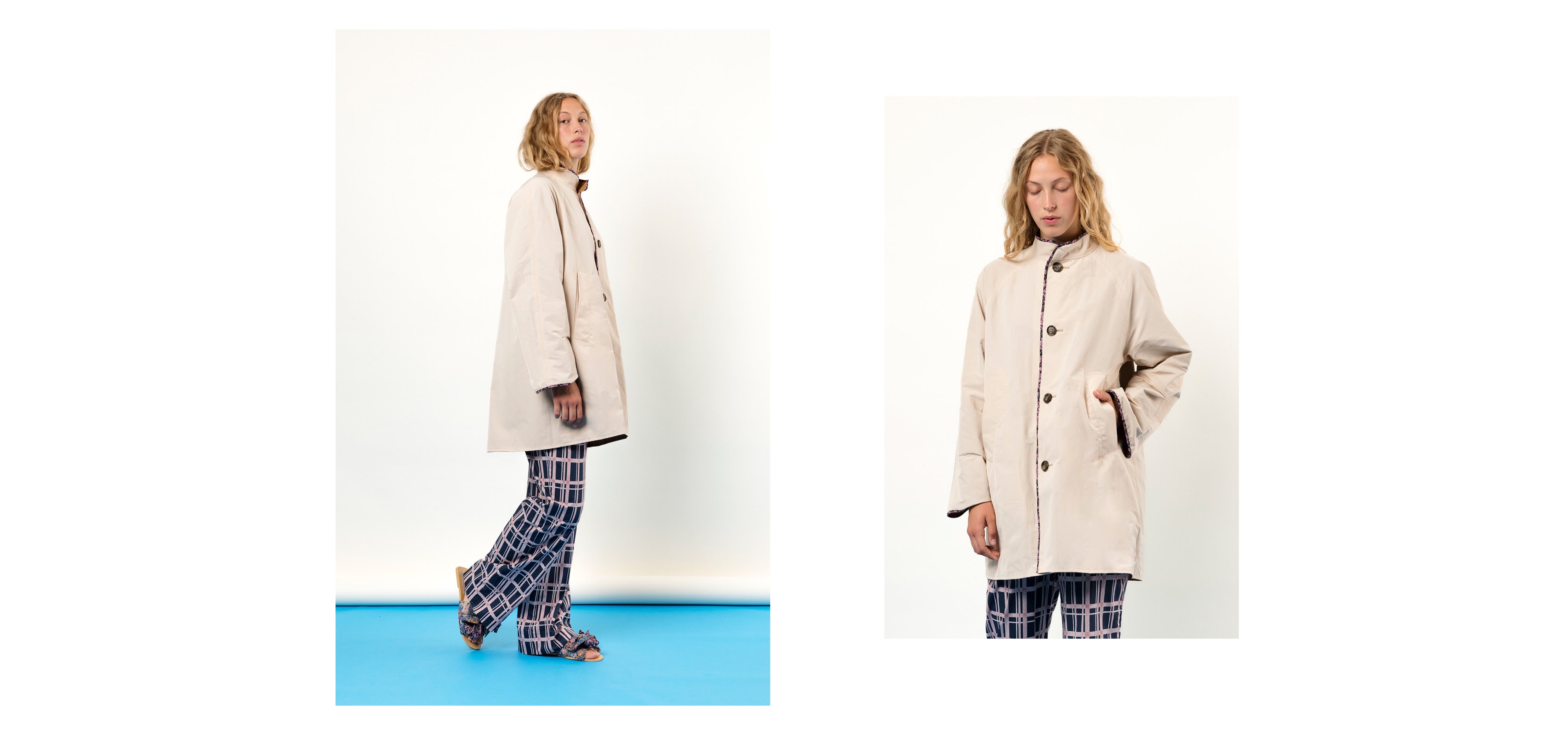 Woman in off-white water repellant jacket with buttons and pockets and blue and pink pants with checks
