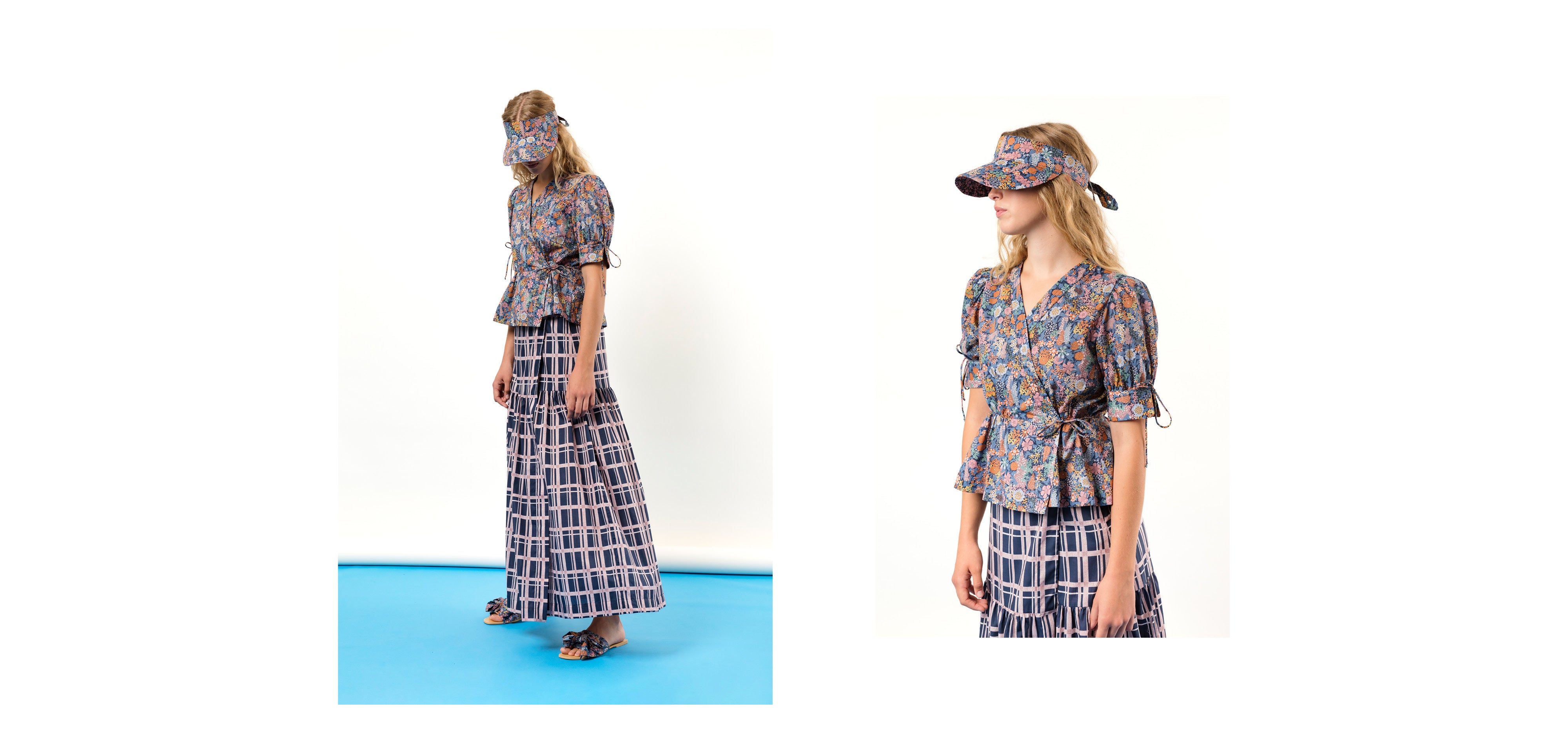 Woman in wrap maxi skirt with checked pattern and multi-colored floral patterned wrap shirt and sun shade cap