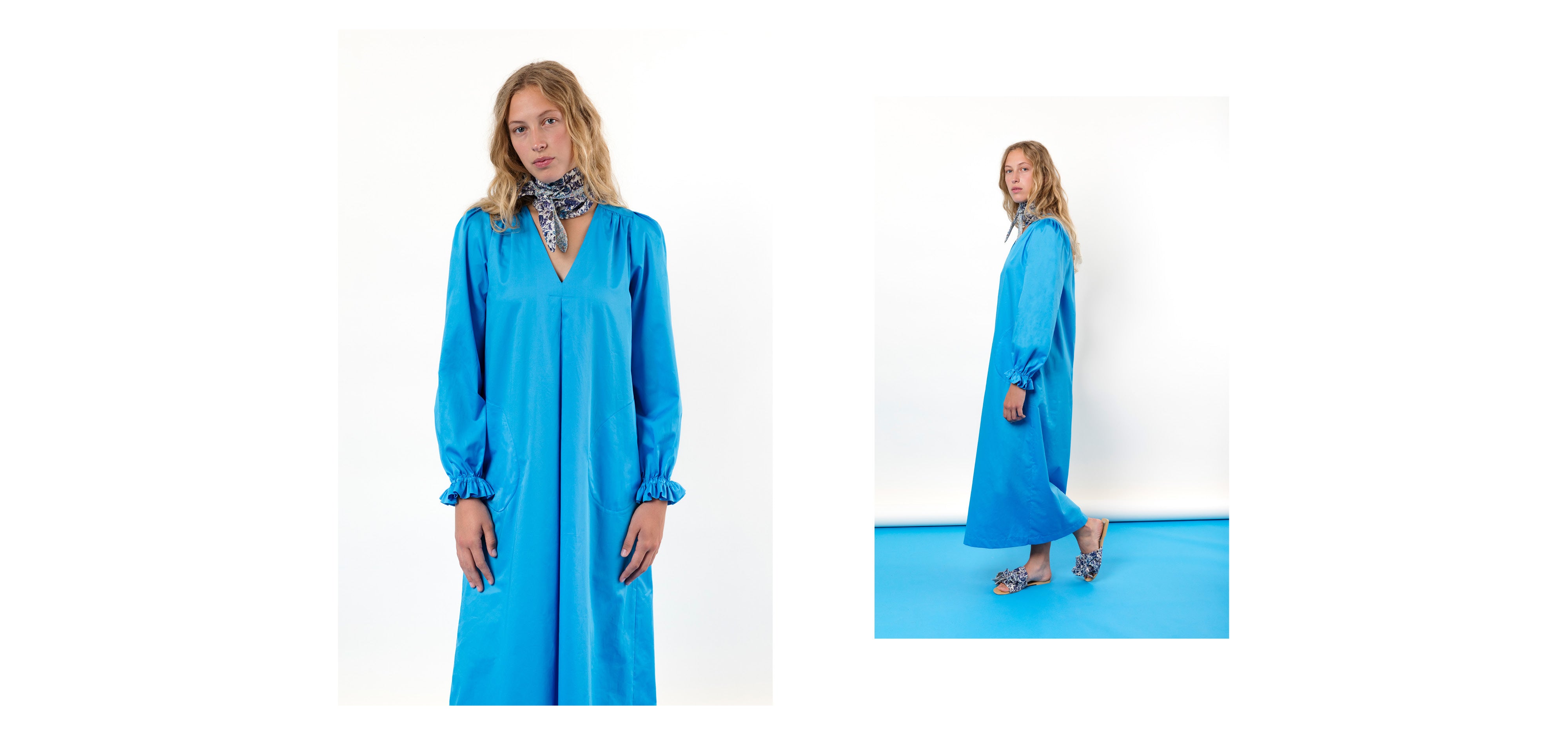 Woman in turquoise maxi dress with long pufed sleeves and v-neck