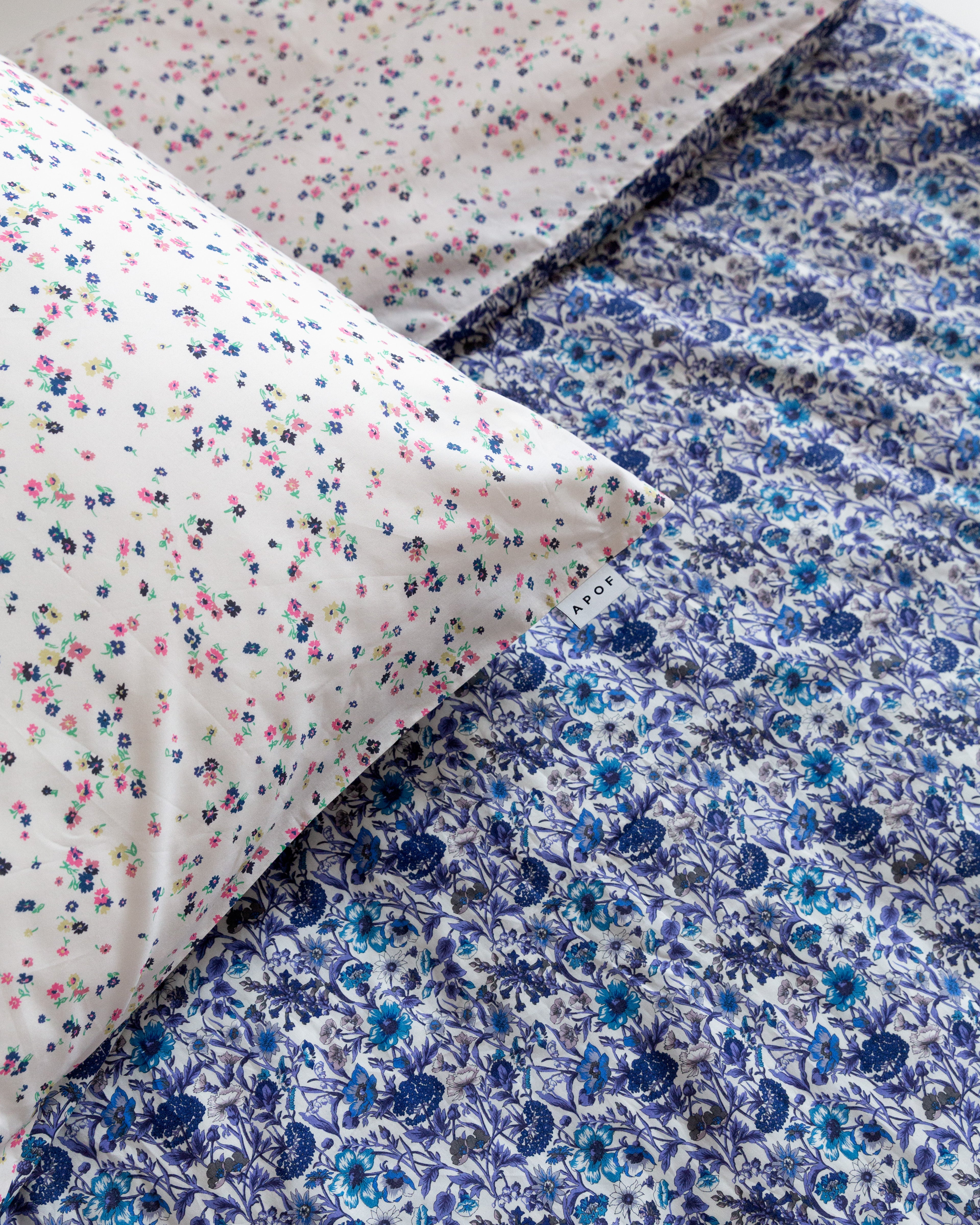 Pillow cover with multi colored and blue flower pattern