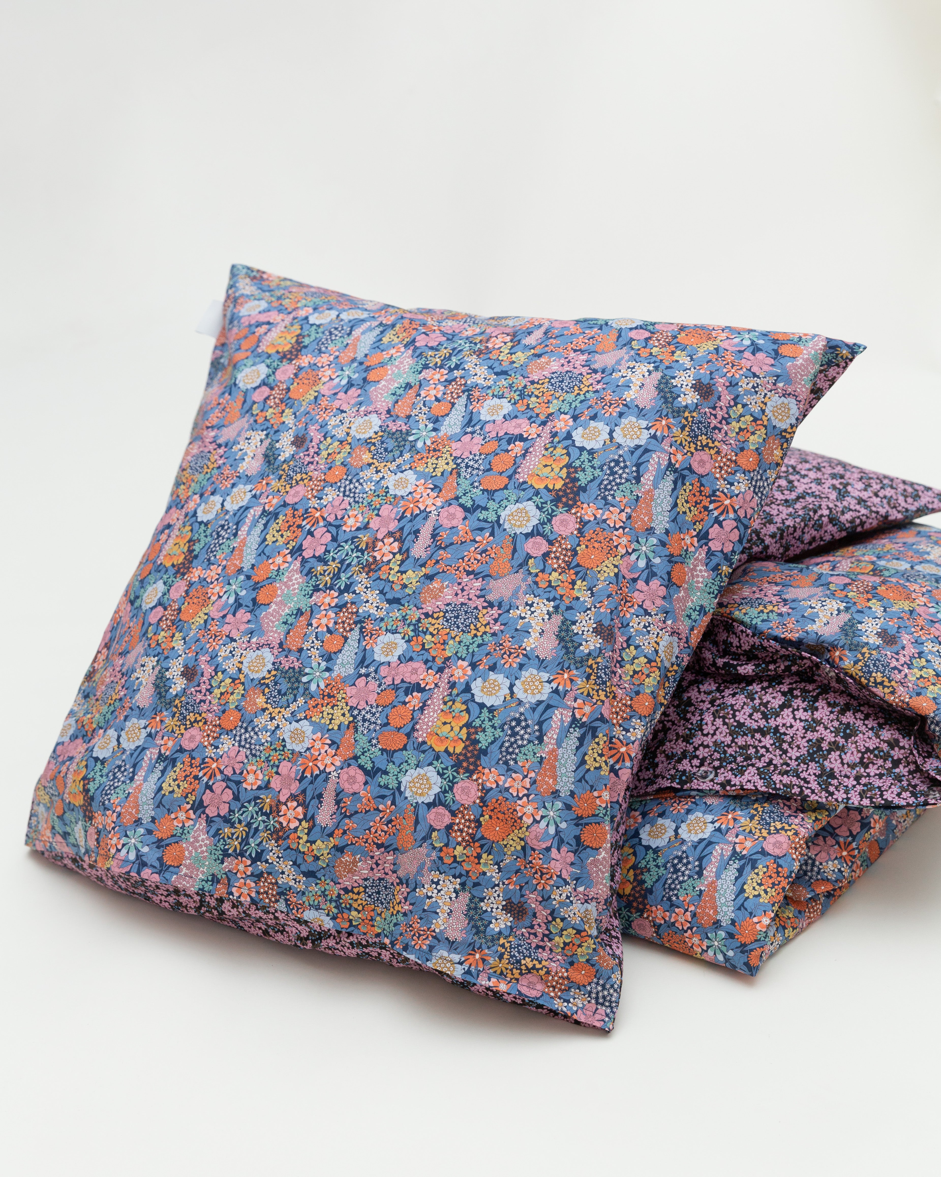 Pillow cover with multi colored flower pattern