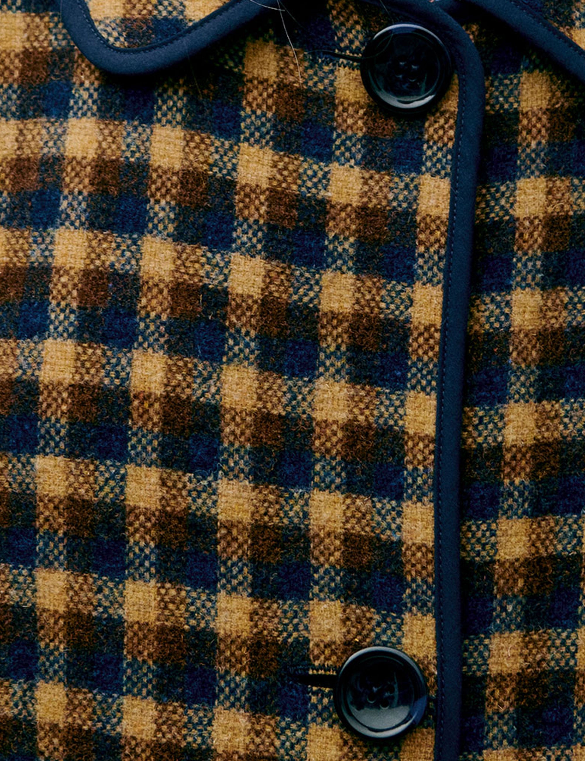 Close-up of a checkered fabric with brown and blue pattern
