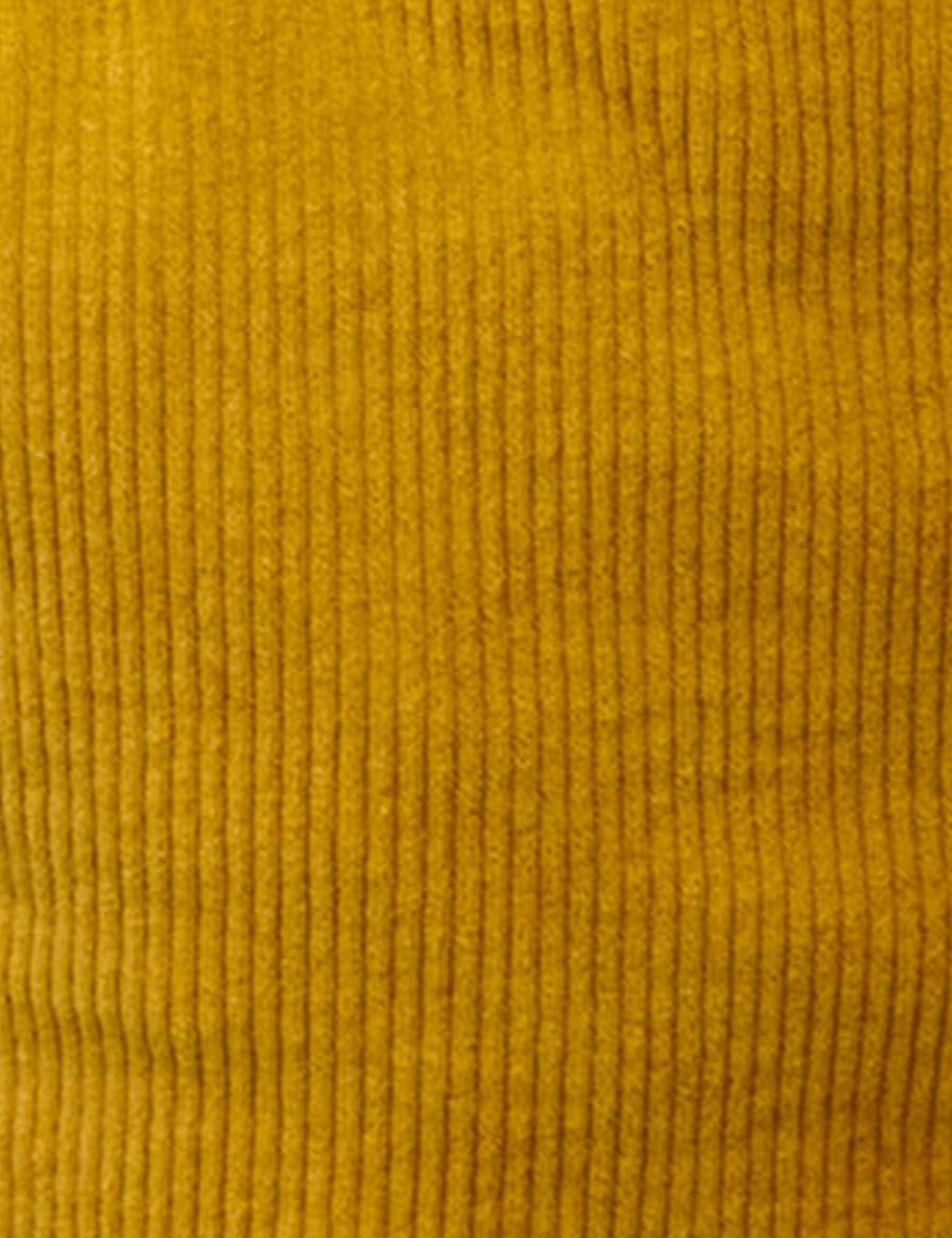 Close up of honey yellow corduroy fabric