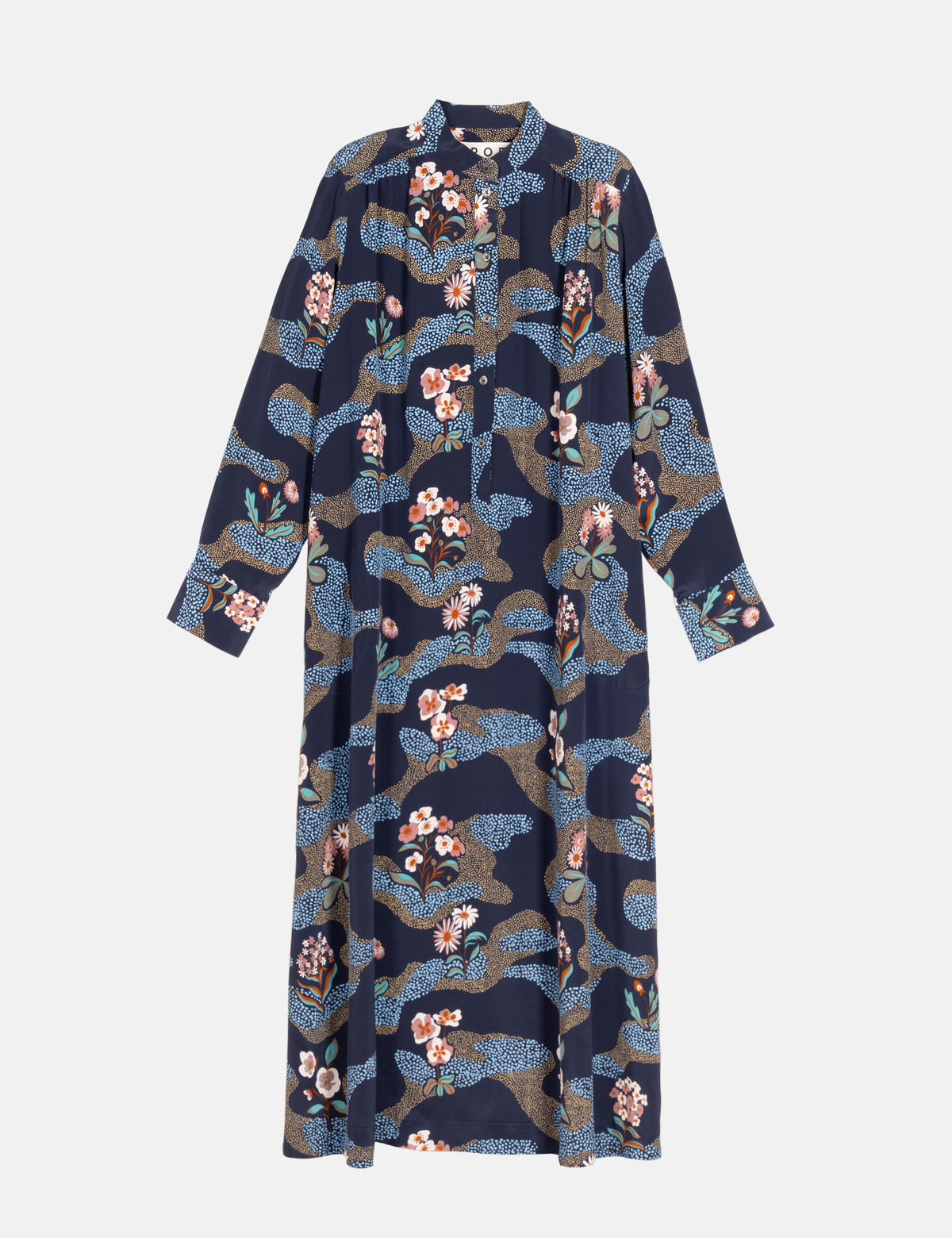 A long-sleeve button-front dress with a navy base and an all-over abstract floral pattern in blue, beige, and pink, shown on a light gray background.