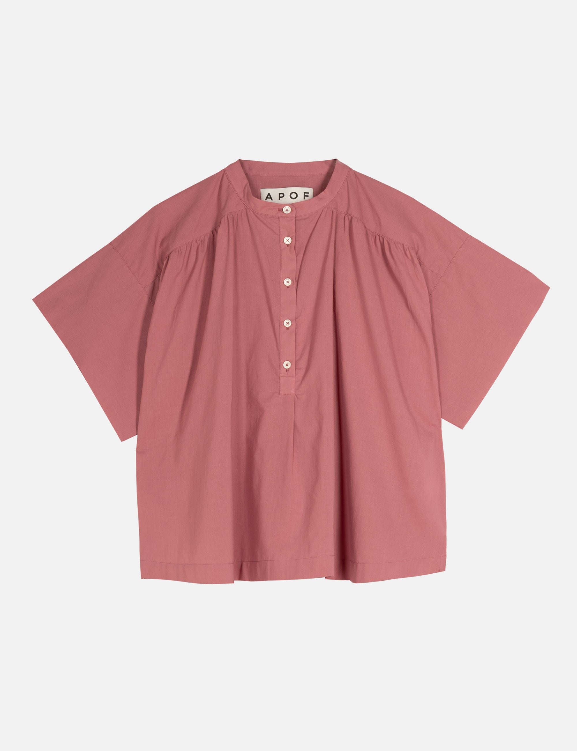 Pink shirt with brand label on a light gray background