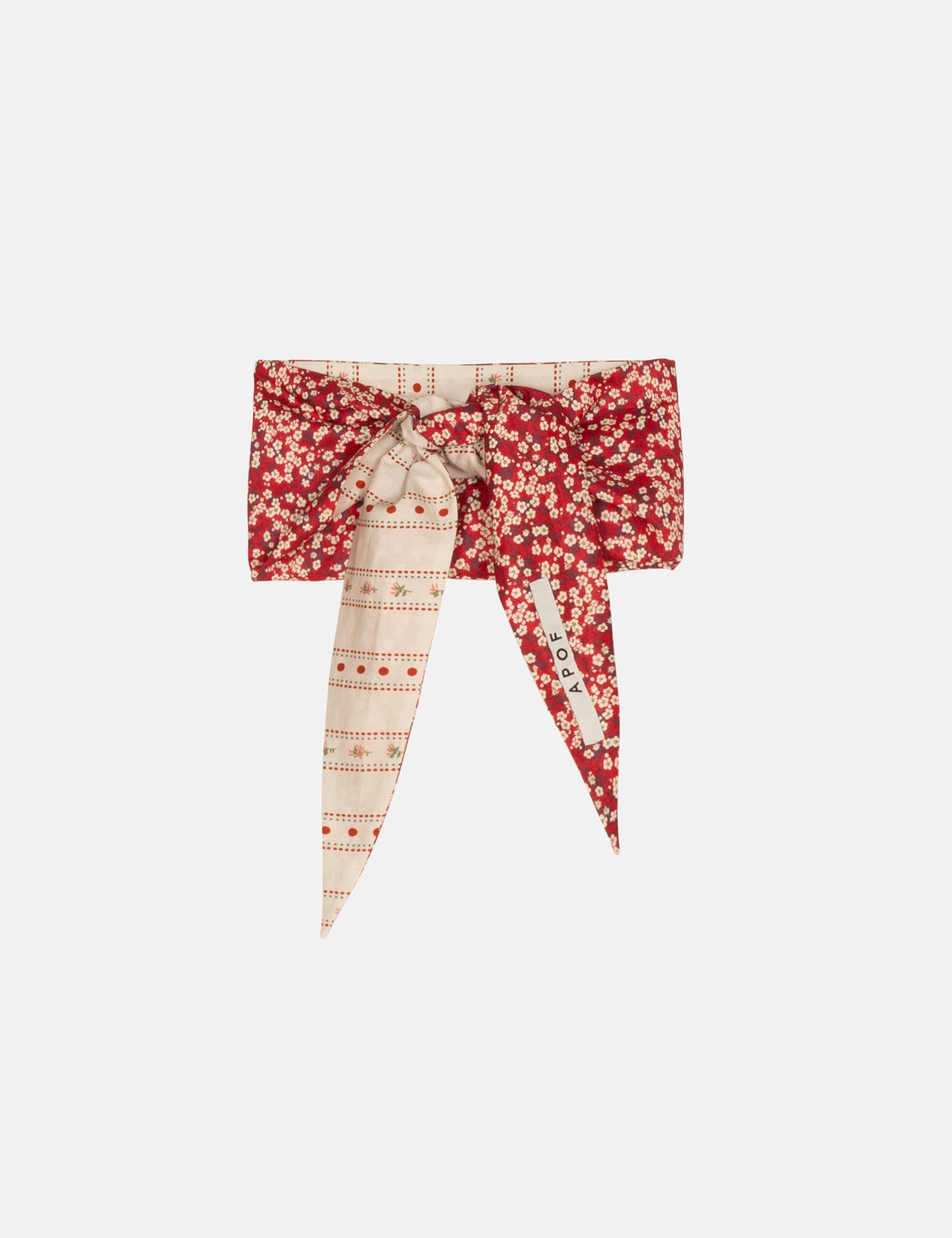 Red and white flower patterned scarf on a white background
