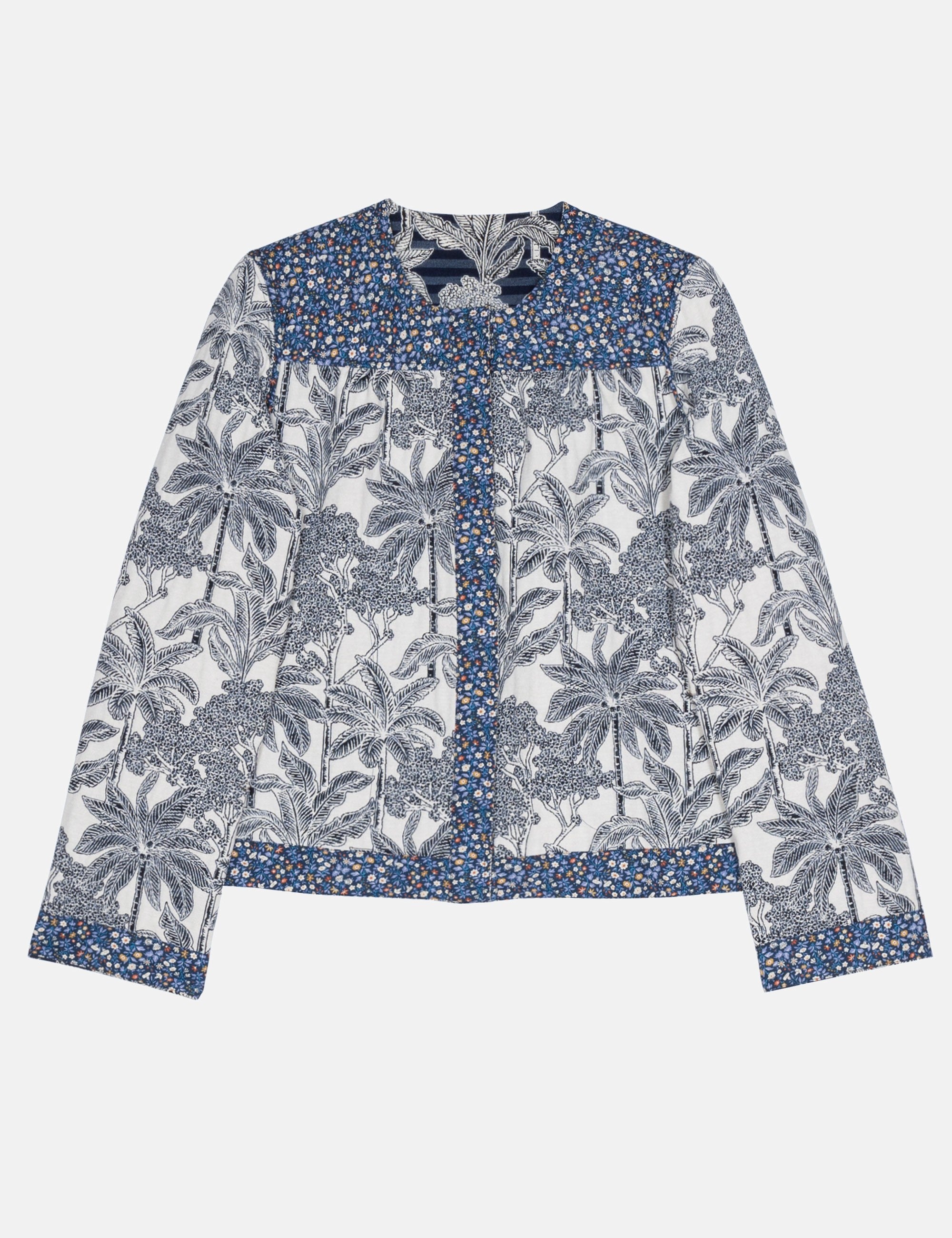 Blue floral patterned blouse on a white background
