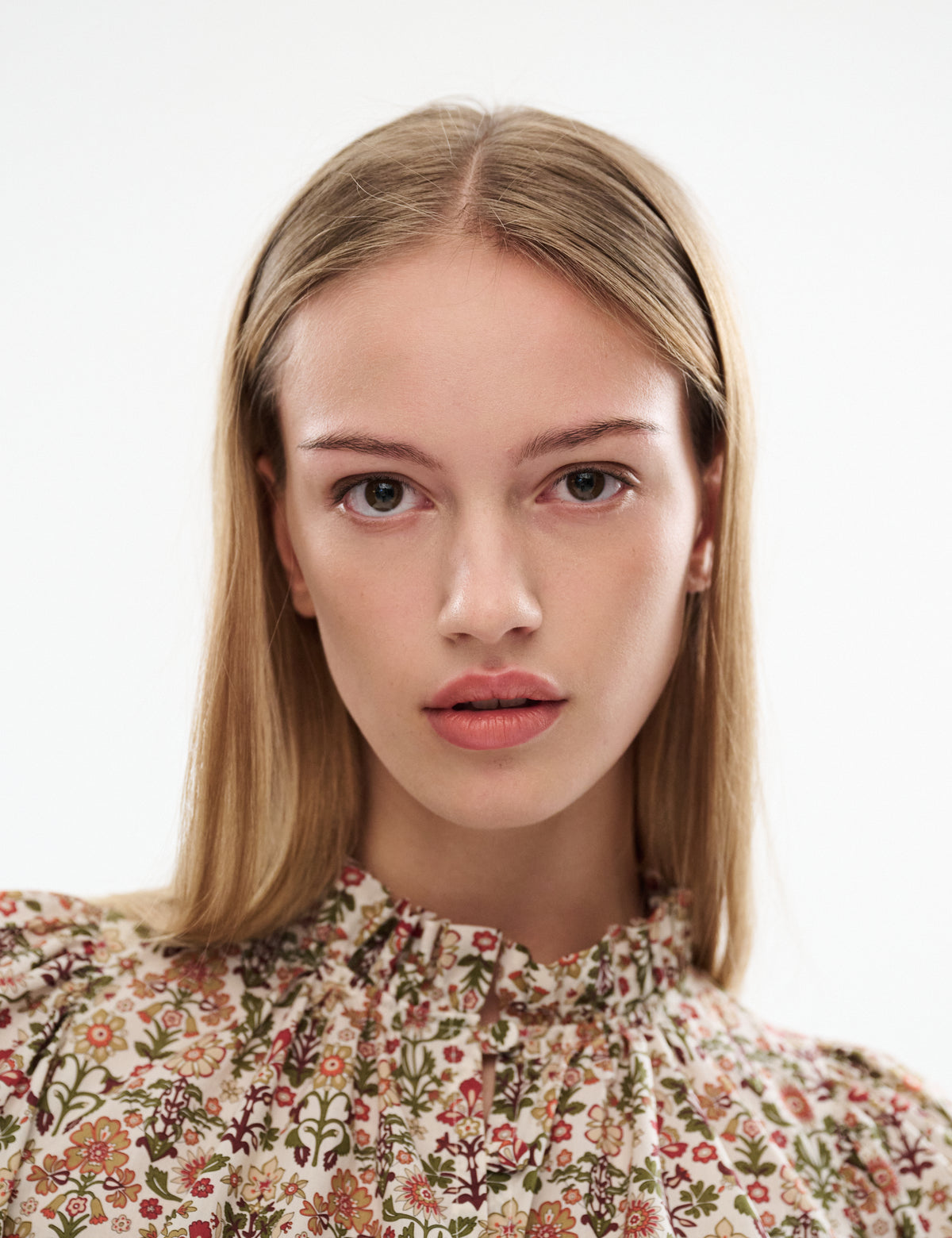 Annabella blouse with high gathered neckline and long sleeves, floral print on cream