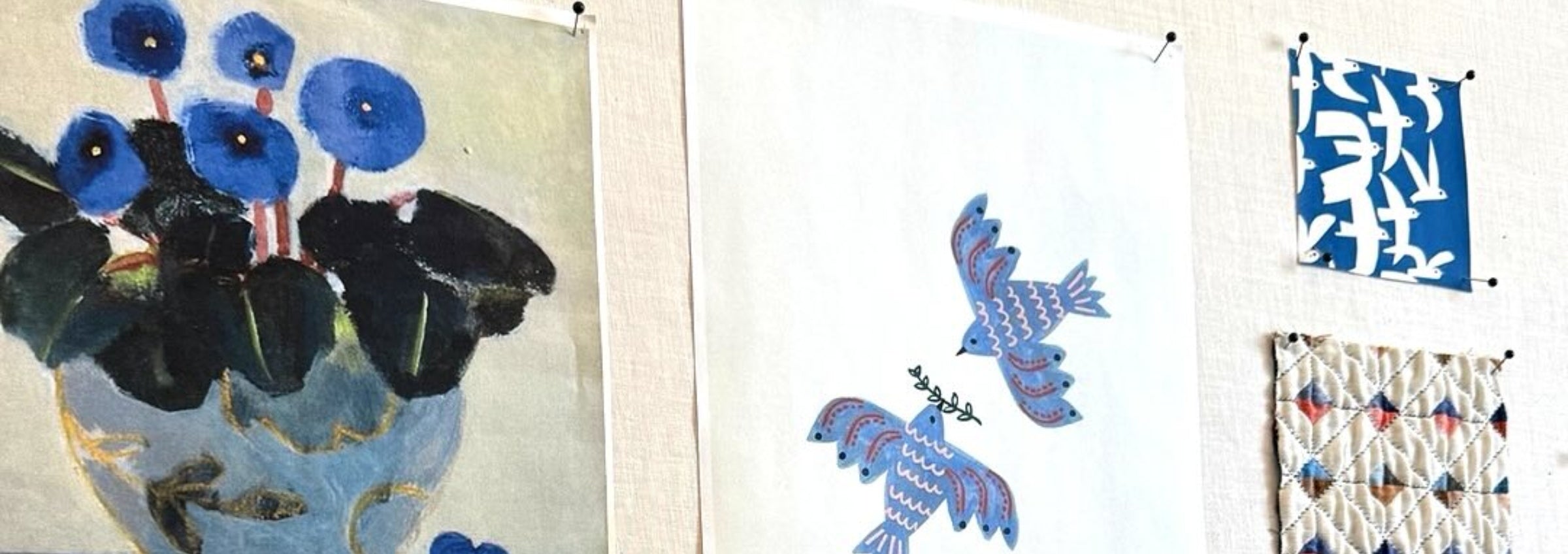 Collage of fabric swatches with blue and black floral patterns.