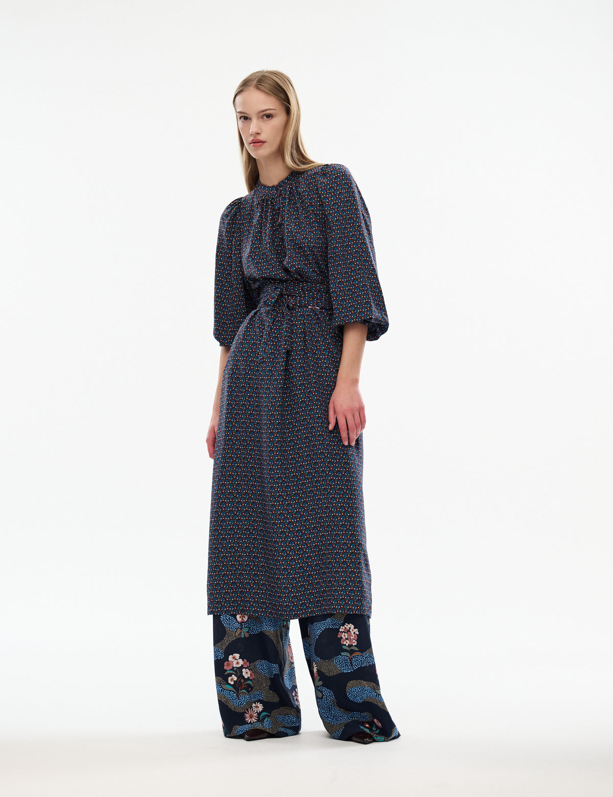 Women’s navy patterned midi dress with balloon sleeves and tied waist belt