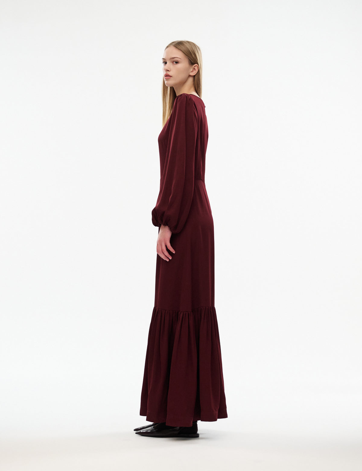 Bourgogne Melodie dress side profile with long sleeves and gathered tiered skirt