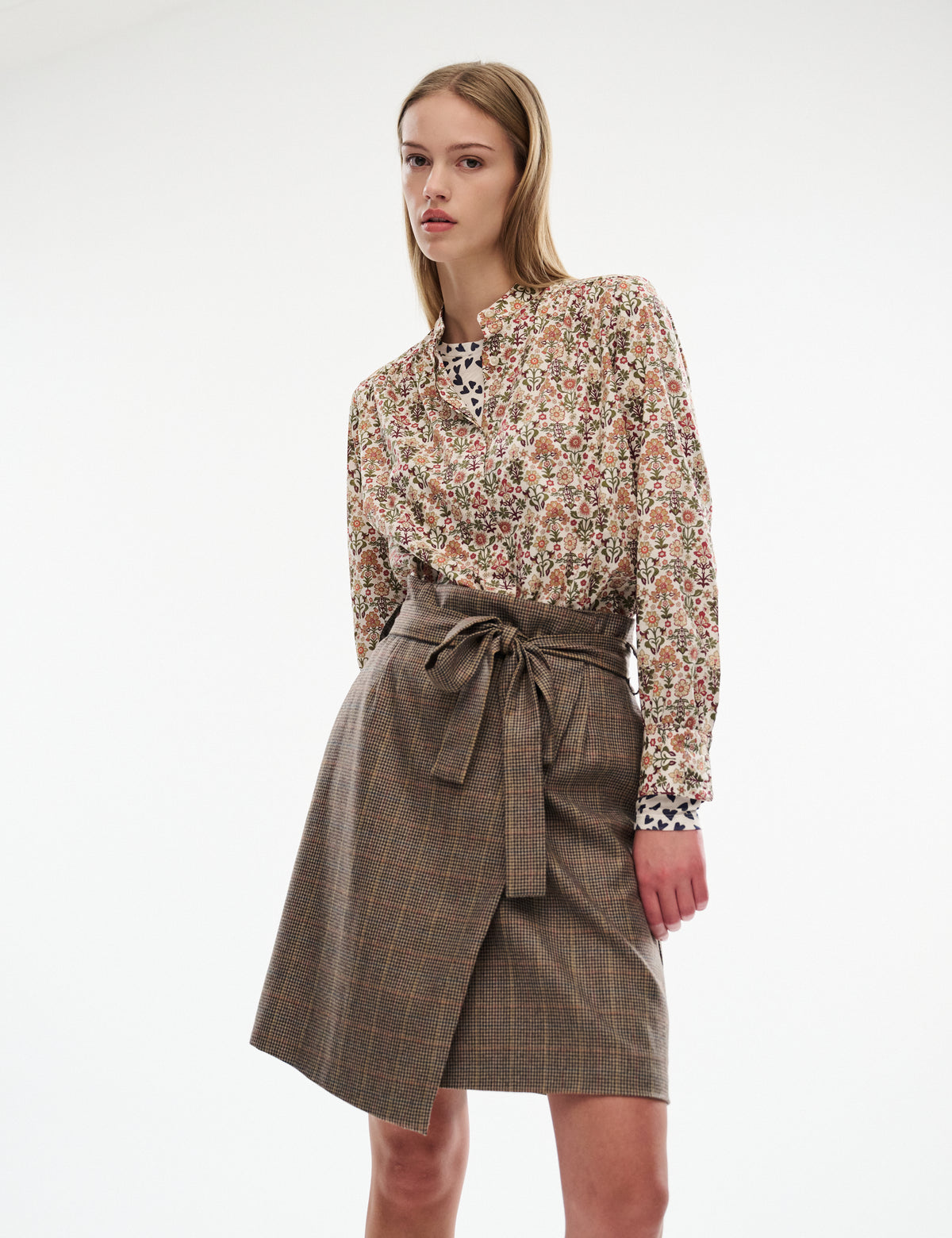 Berita heritage skirt in brown plaid, front tie bow with side drape, above-knee length