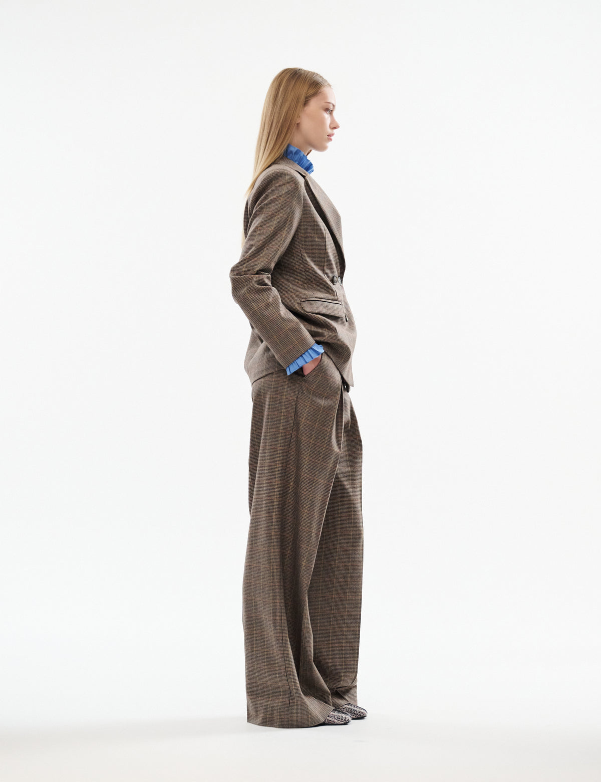Brown plaid wide-leg pants with high waist and relaxed straight legs