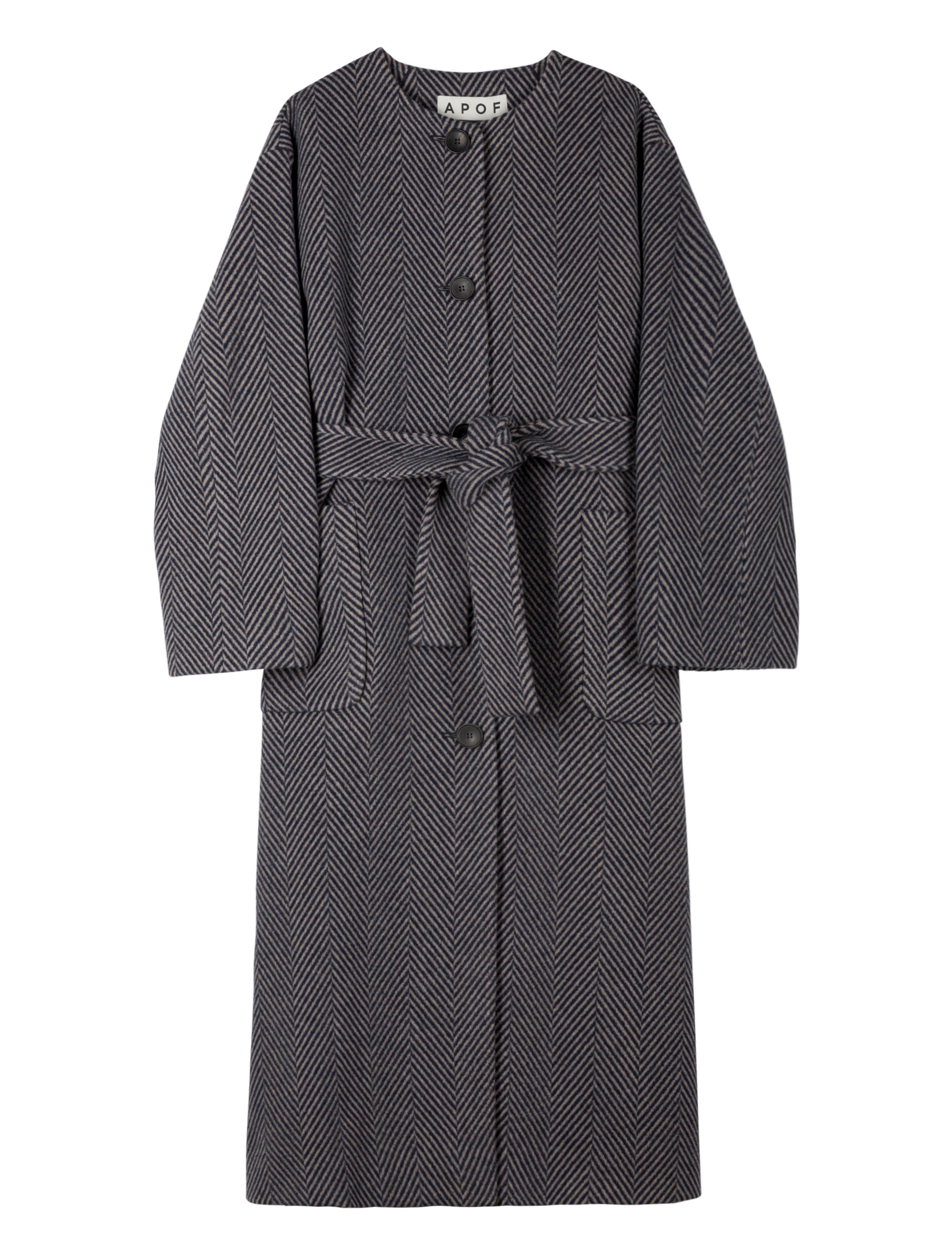 Woman in blue herringbone coat with belt and buttons