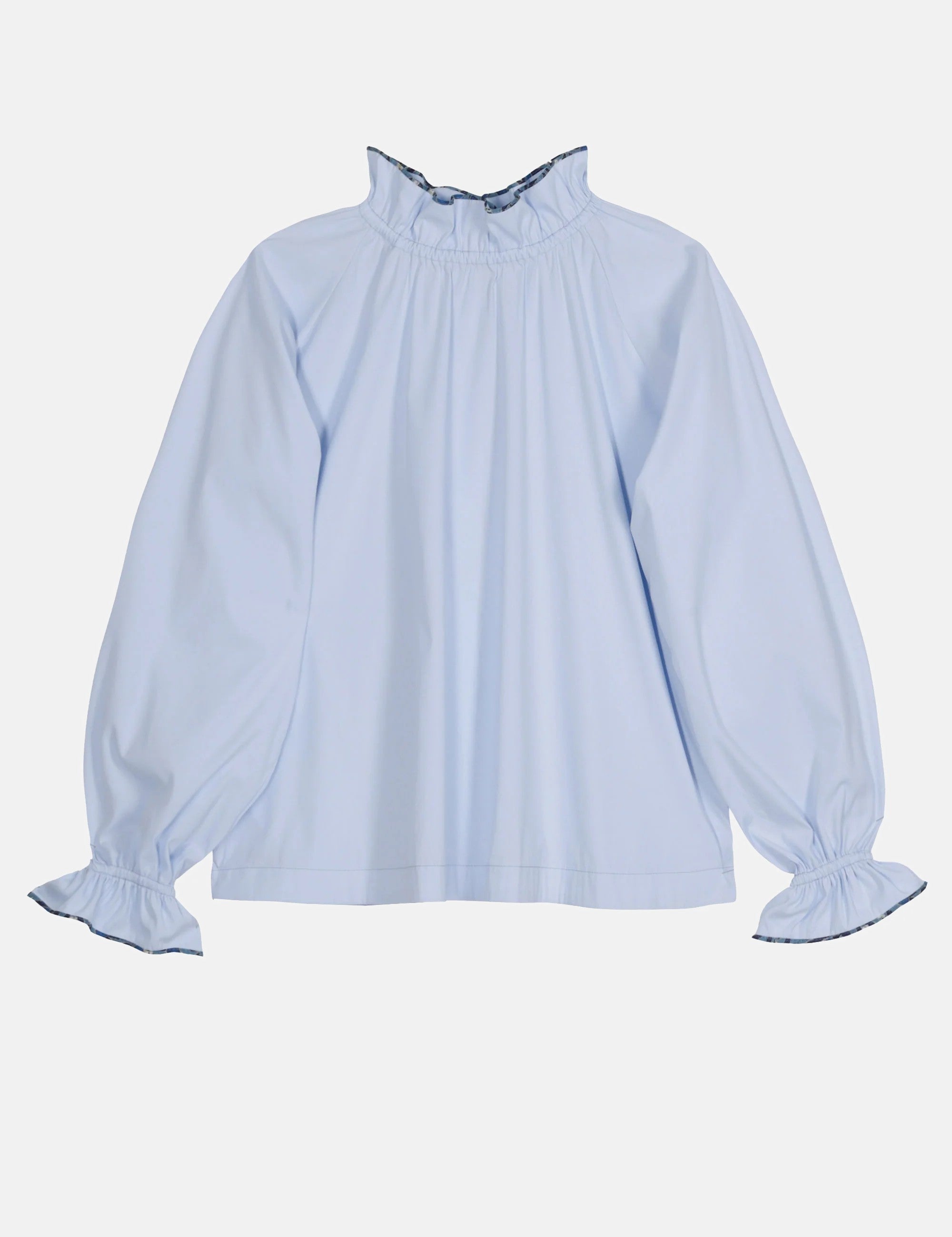 Long sleeved woman's shirt in light blue cotton with frilled stand collar and frilled cuffs