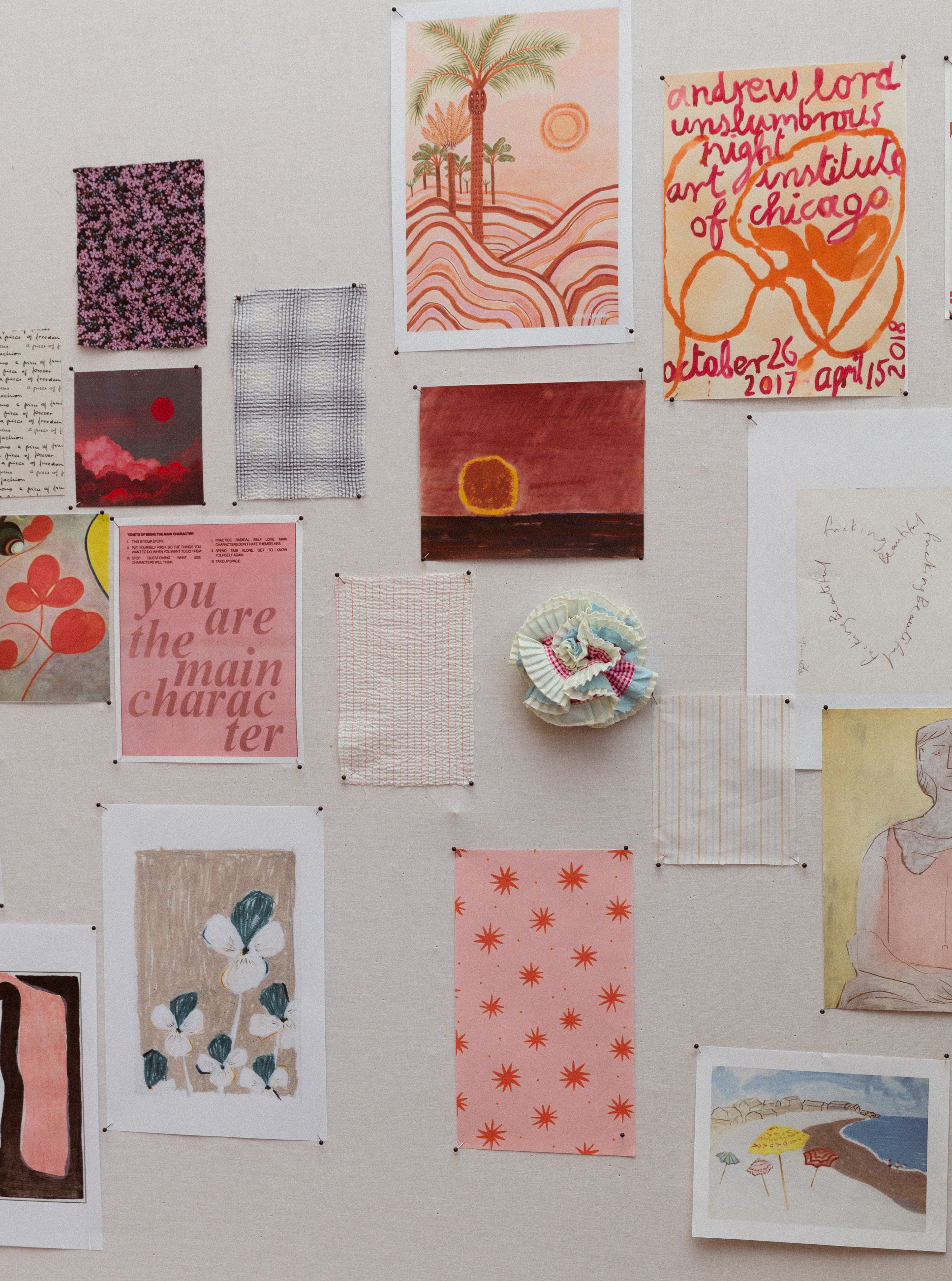 Notes, cards and fabric samples on wall