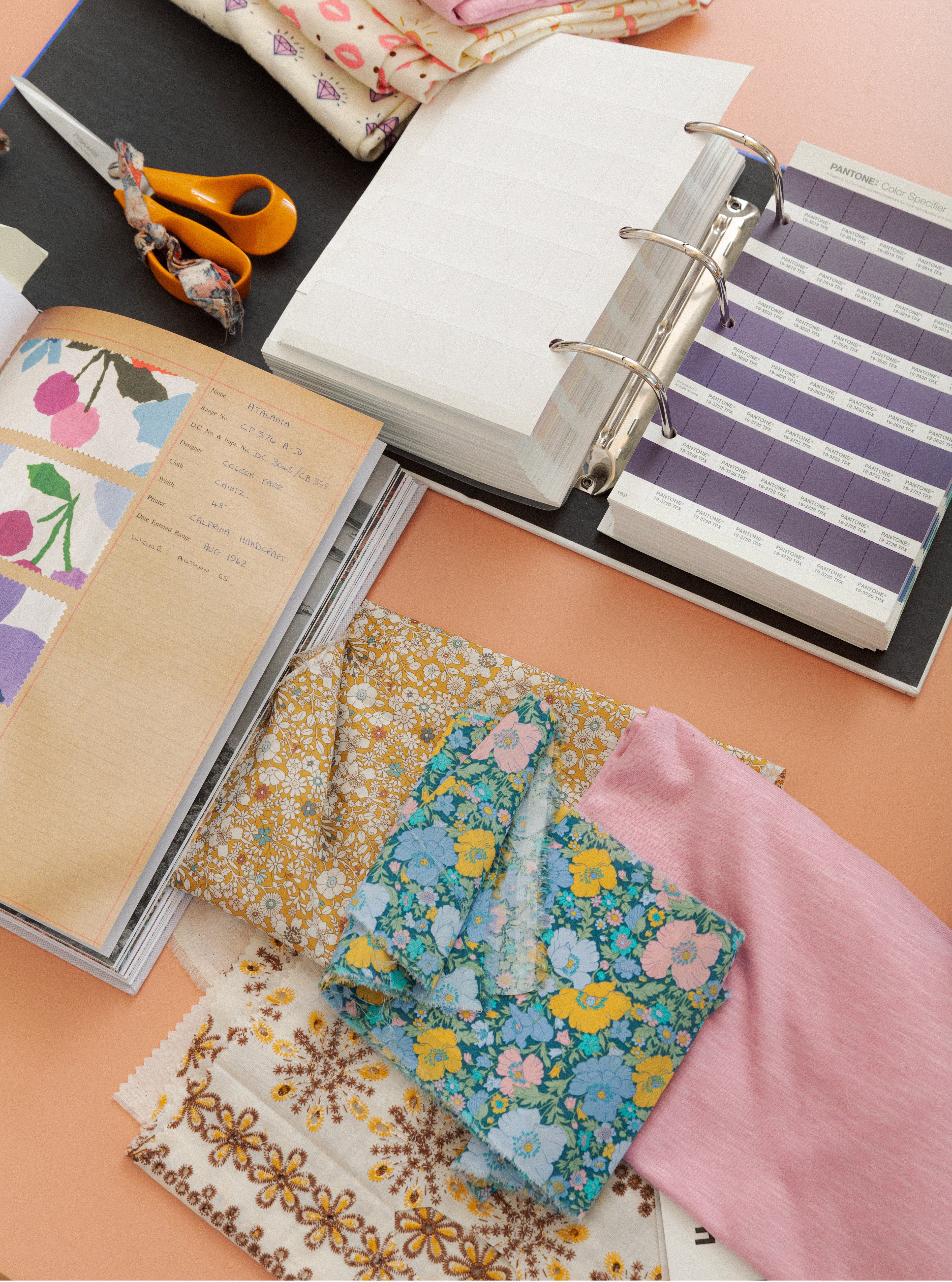 Notebook and Liberty cotton floral patterned fabric samples