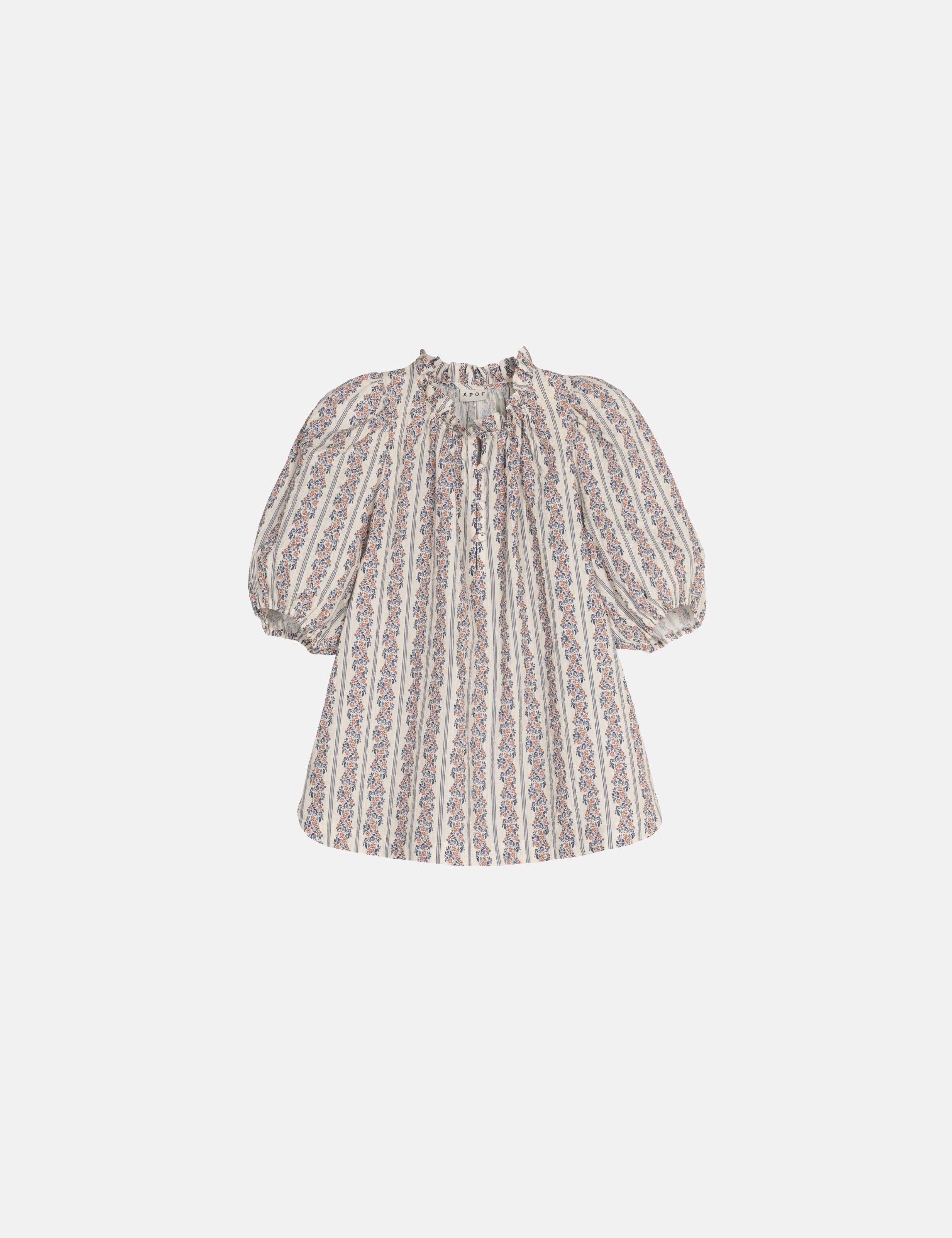 Striped blouse with puff sleeves on a light gray background