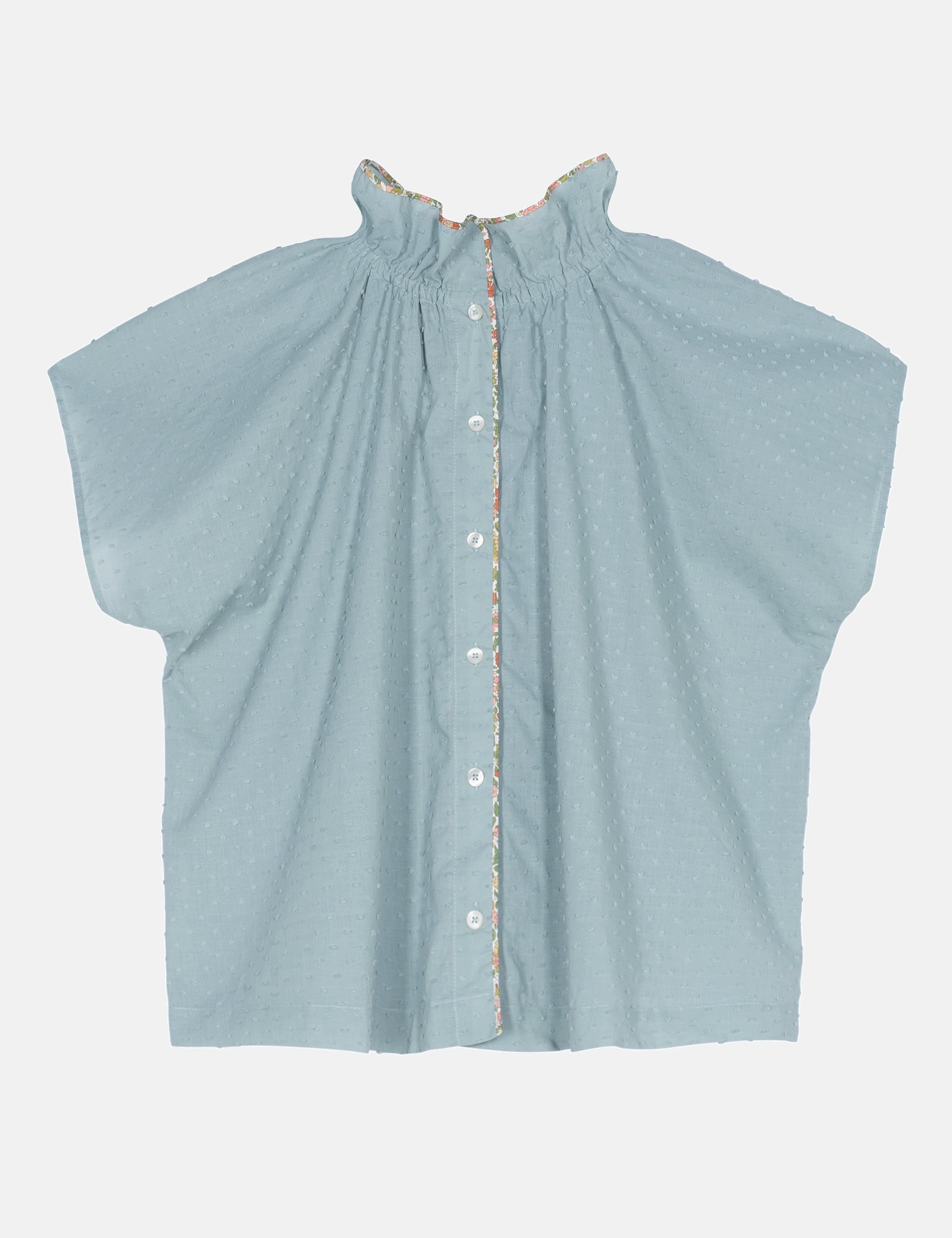 Light blue sleeveless blouse with button details on a white background