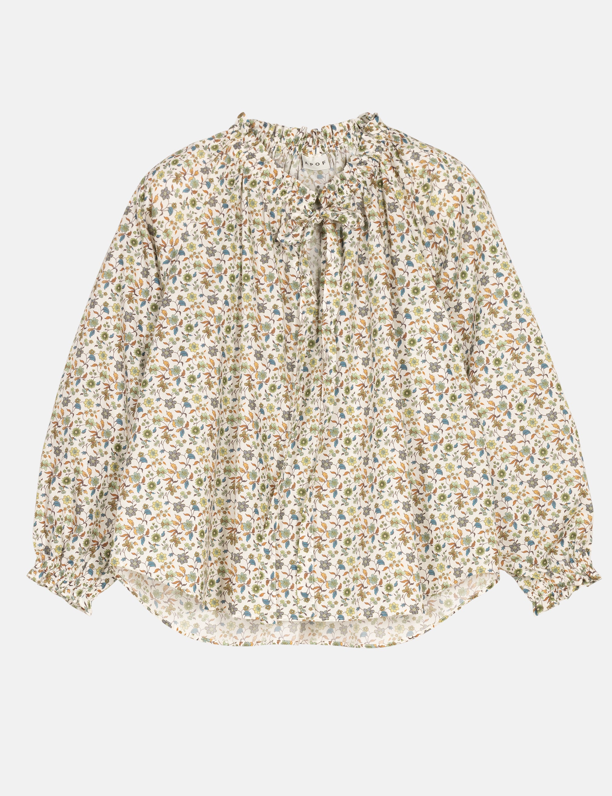 Floral blouse with ruffles and a bow on a light gray background