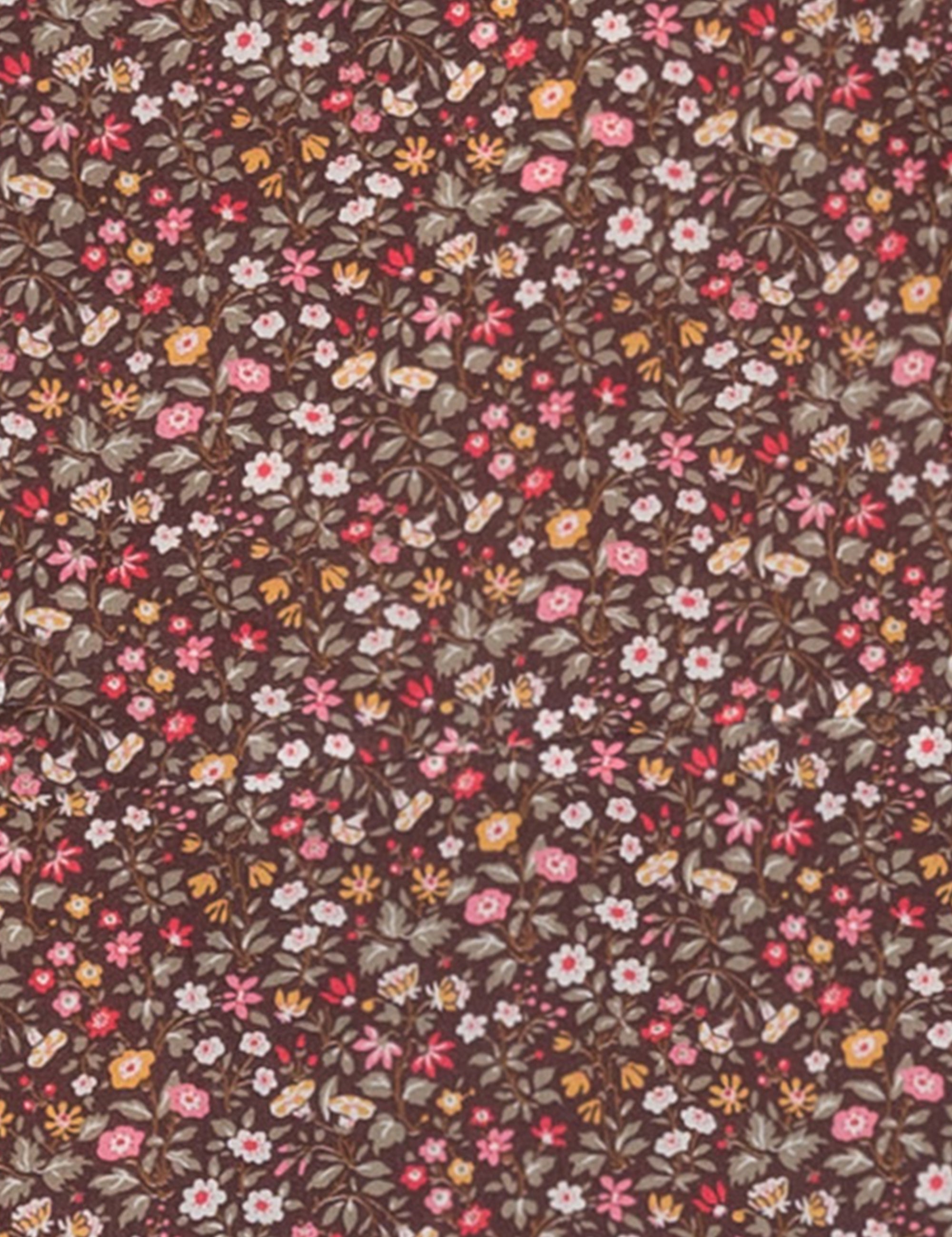 Close-up of brown floral print Liberty cotton called Antheia brown for women's shirts and dresses