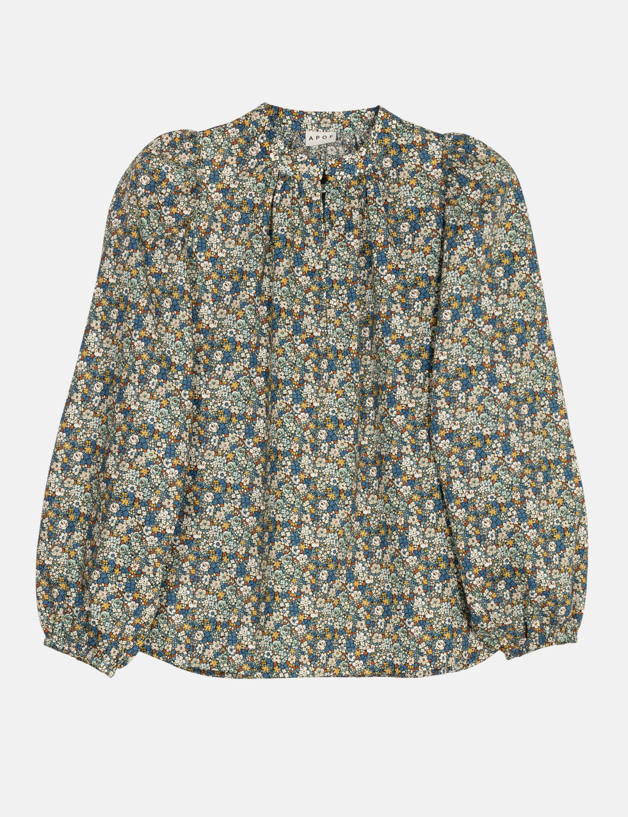 Green and blue floral patterned blouse with long sleeves on a white background