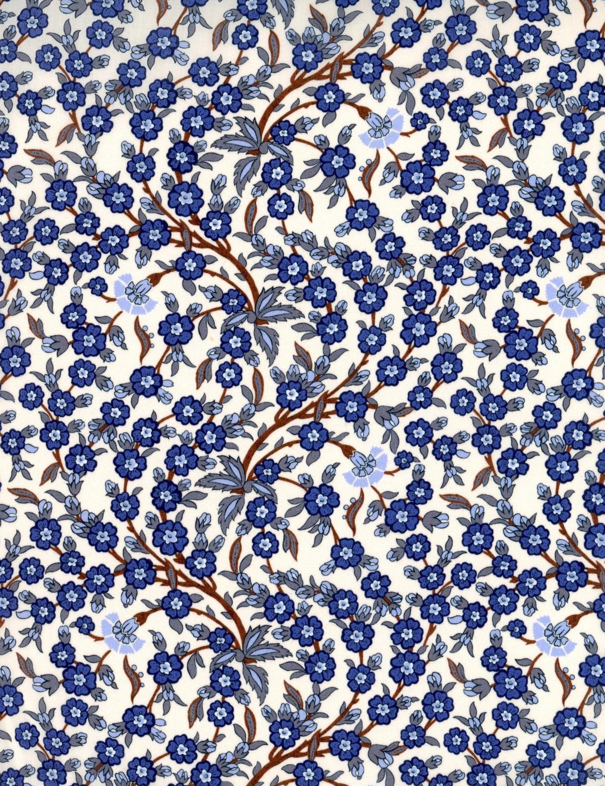 Closeup of blue and white floral print Liberty cotton called Empress blue