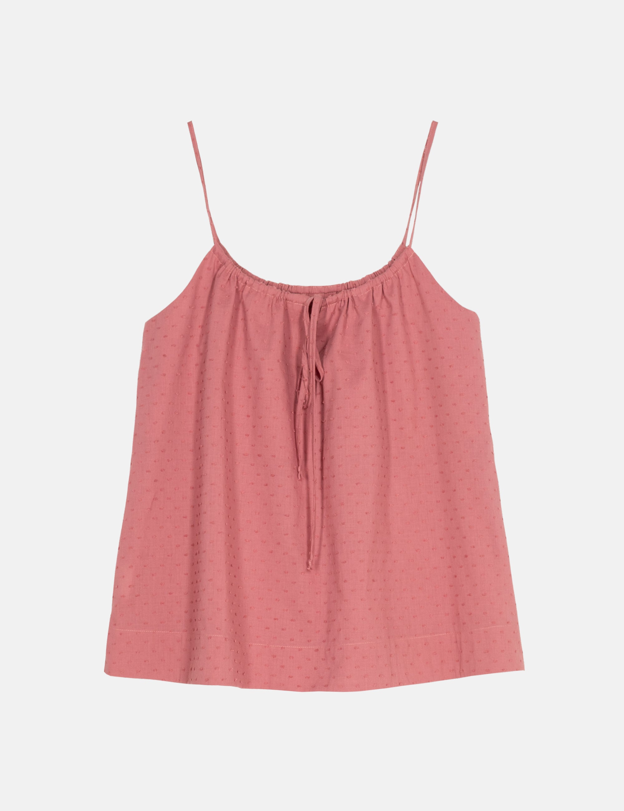 Pink camisole top with thin straps on a light gray background