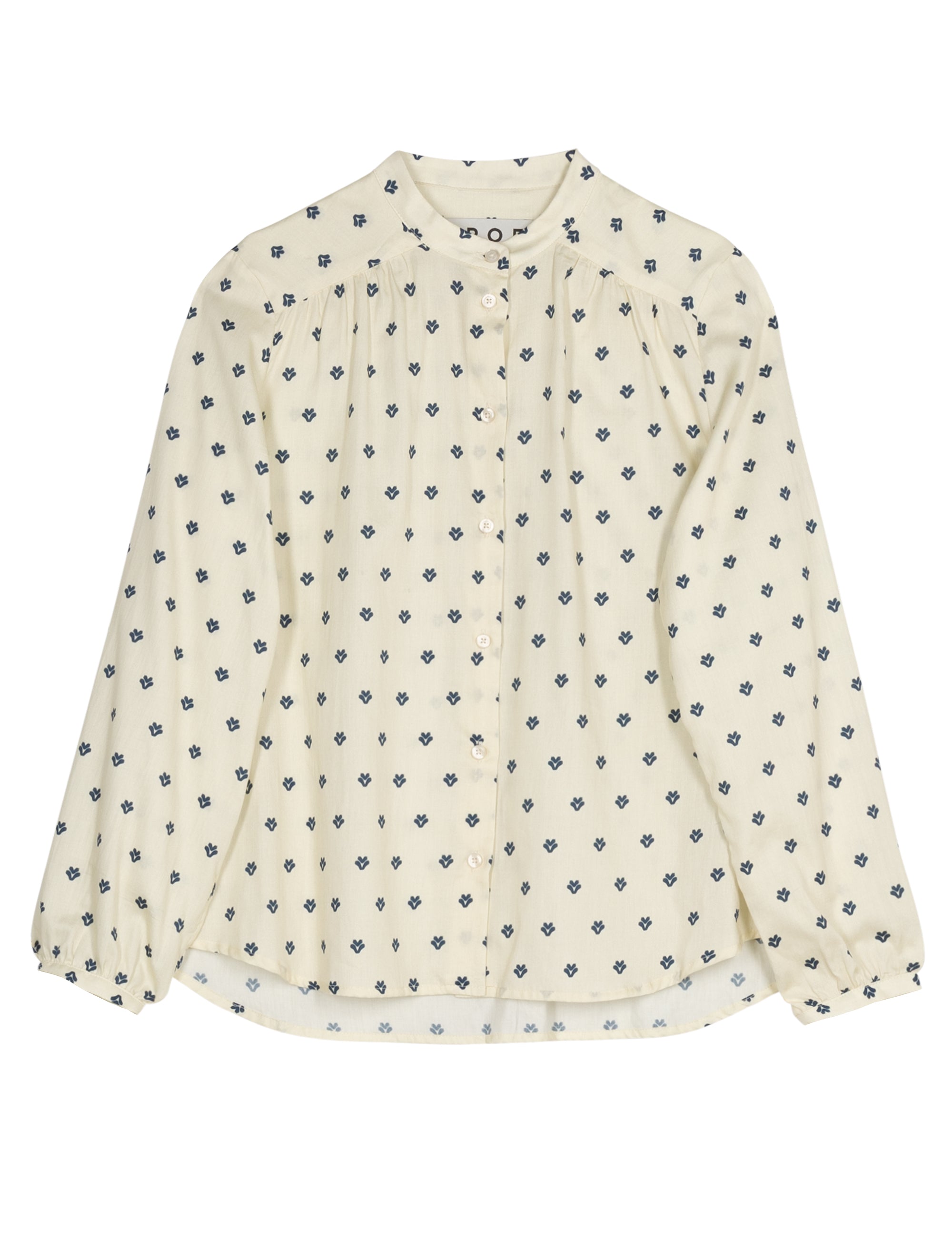 White long sleeve blouse with small blue floral pattern on a white background