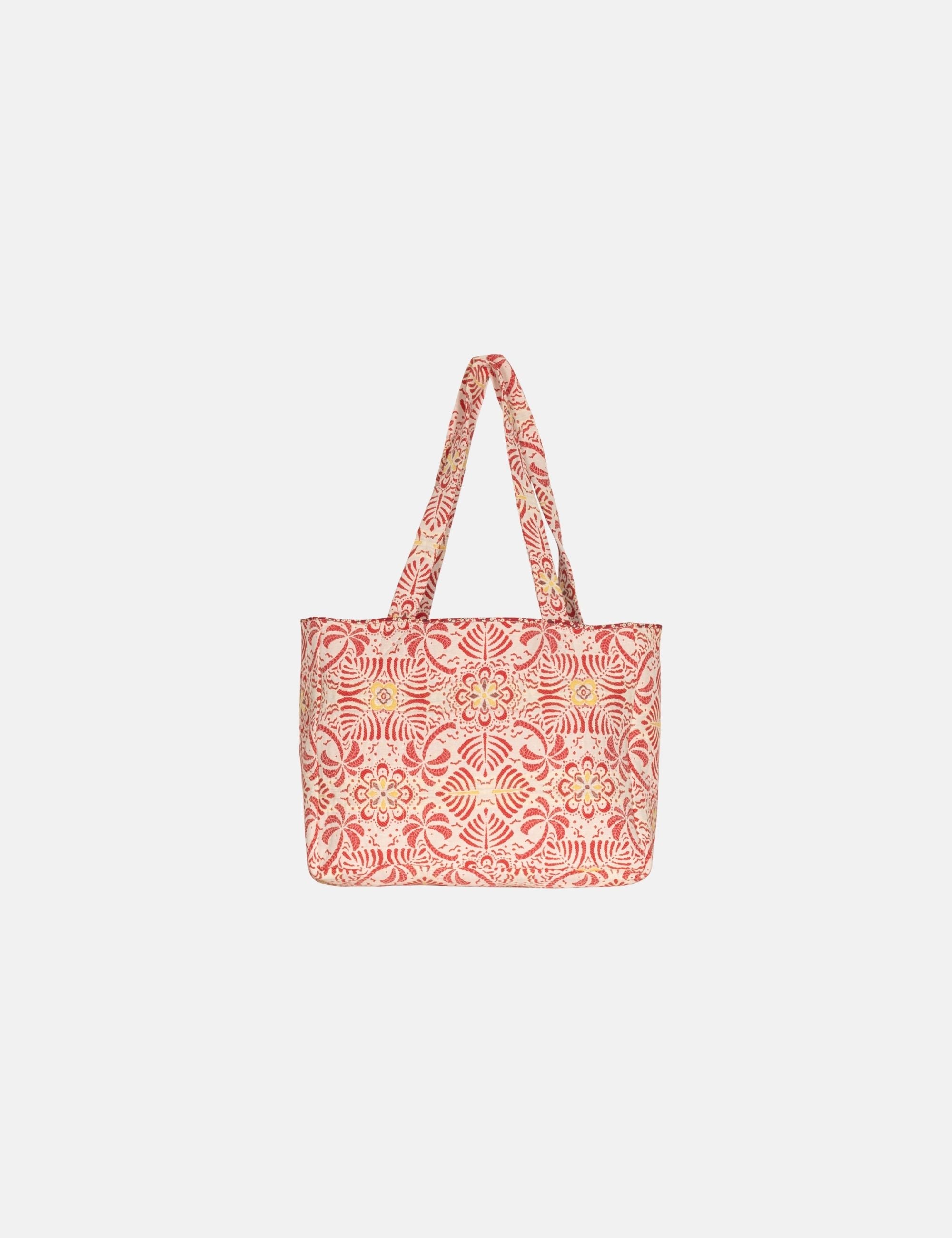 Red and white patterned tote bag on a light gray background