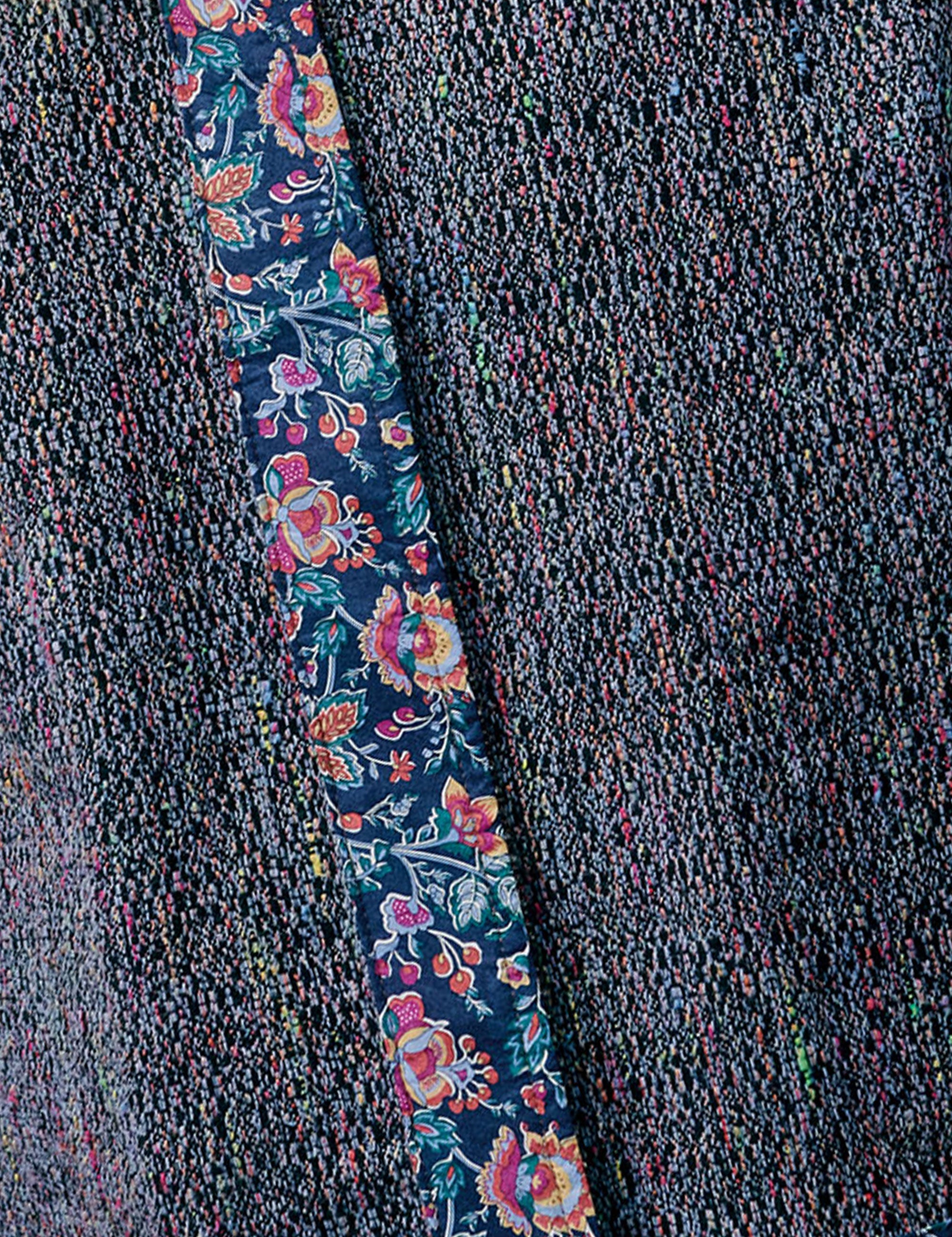 Closeup of jacquard fabric with floral pattern and stripes